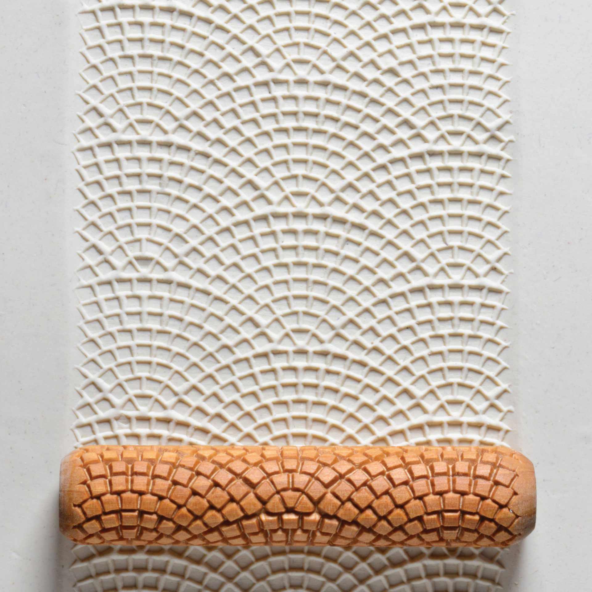 MKM Pottery Tools Big Hand Roller - Cobblestones applied to clay