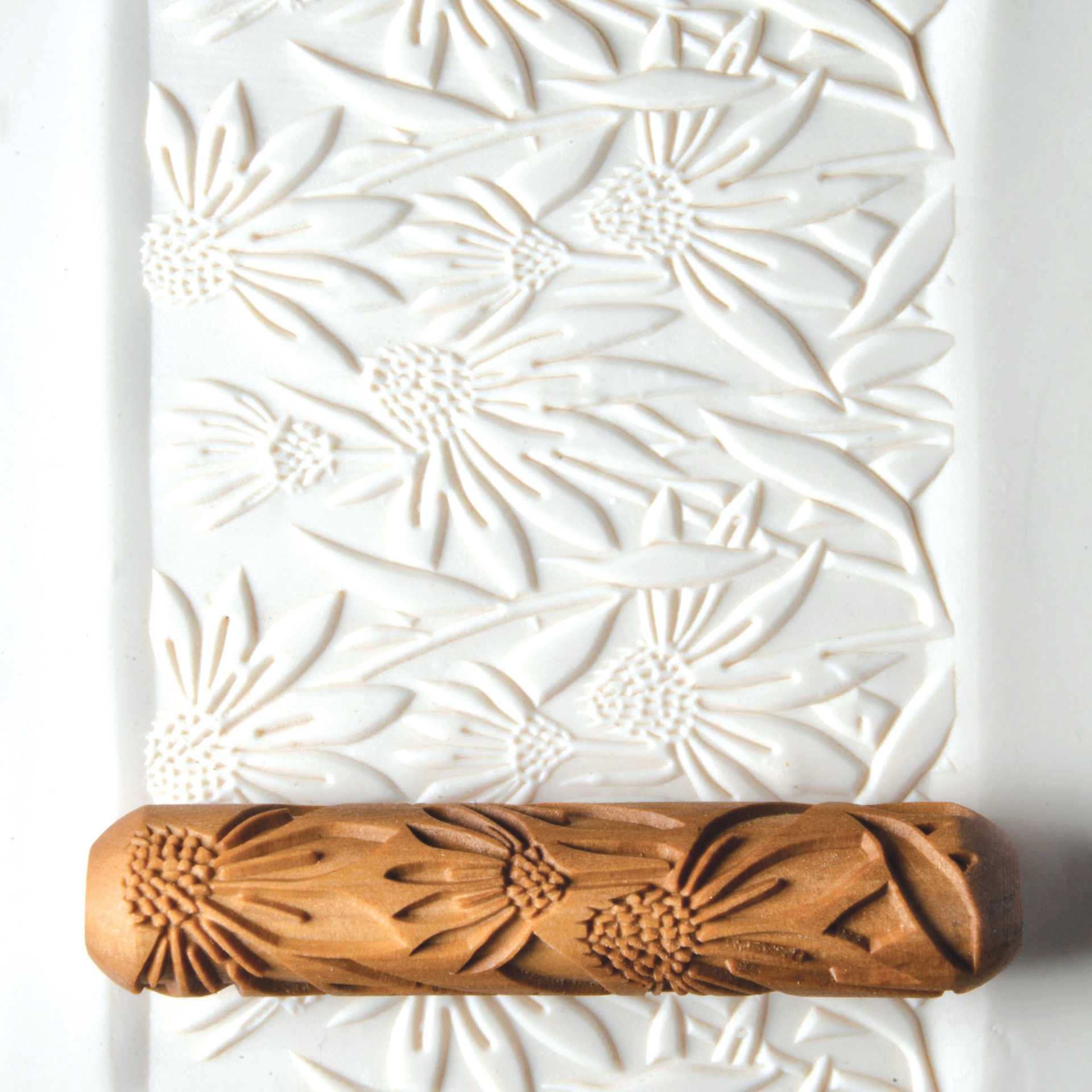 MKM Pottery Tools Big Hand Roller - Coneflower applied to clay