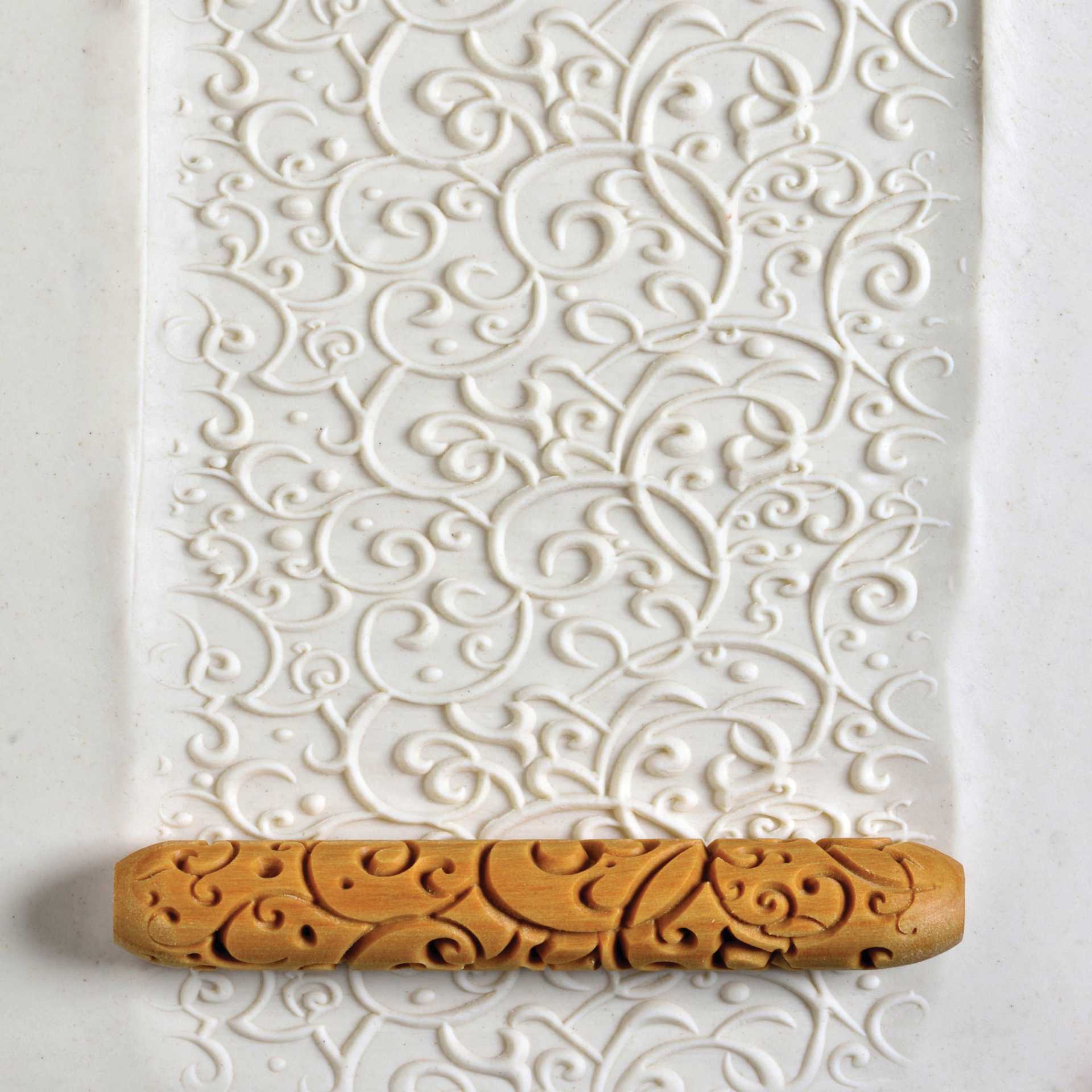MKM Pottery Tools Hand Roller - Curlicue applied to clay