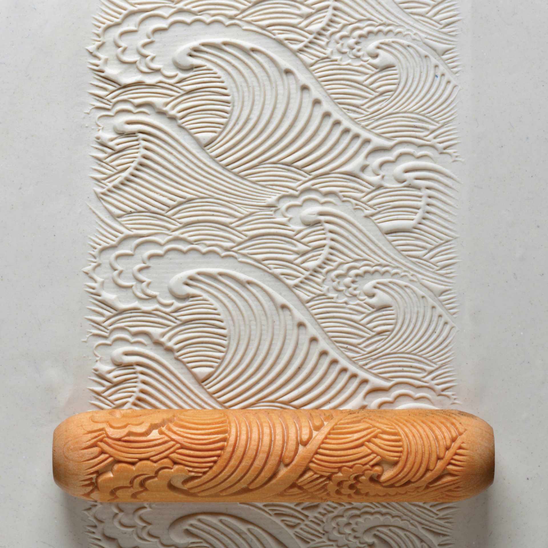 MKM Pottery Tools Big Hand Roller - Big Wave applied to clay