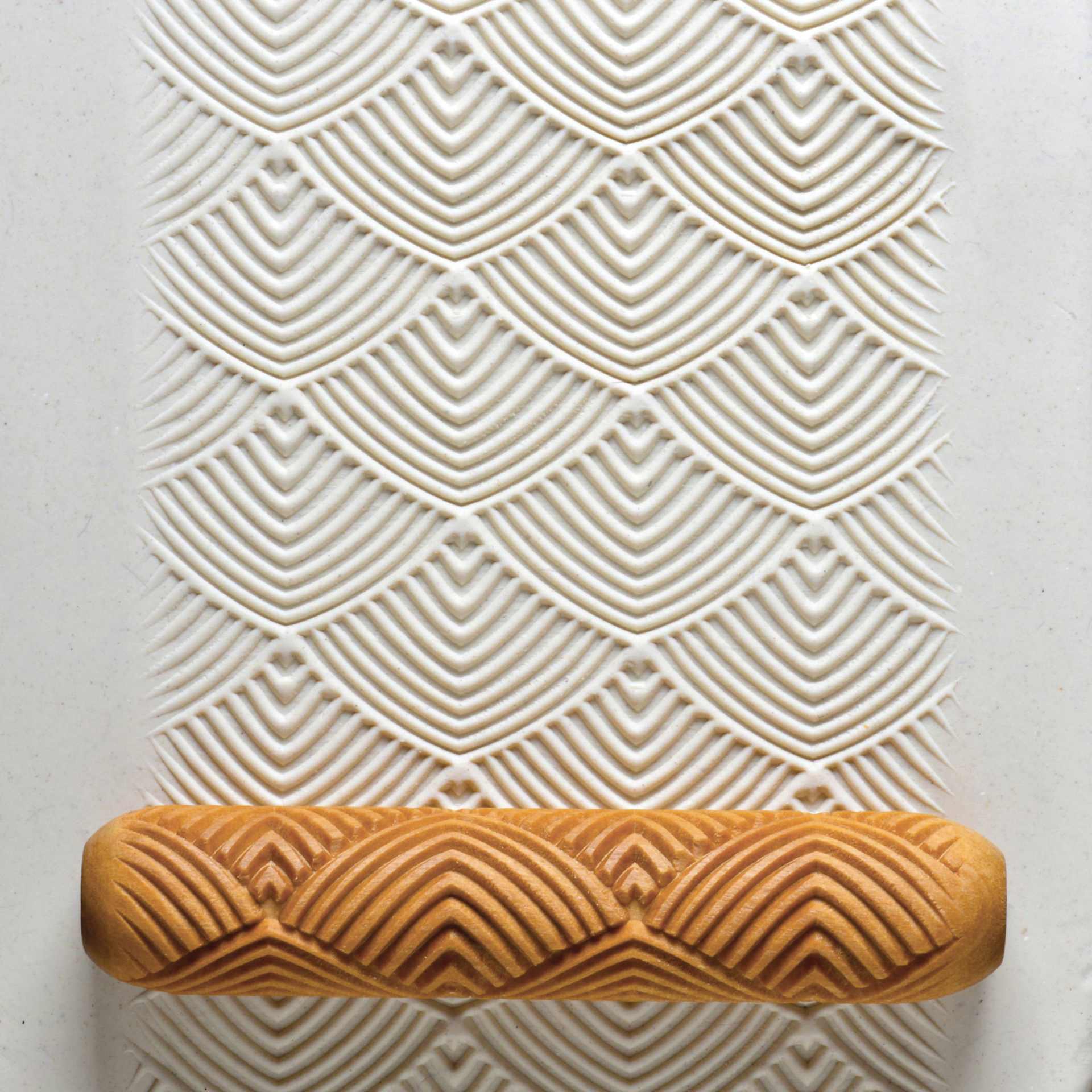 MKM Pottery Tools Big Hand Roller - Feathers applied to clay