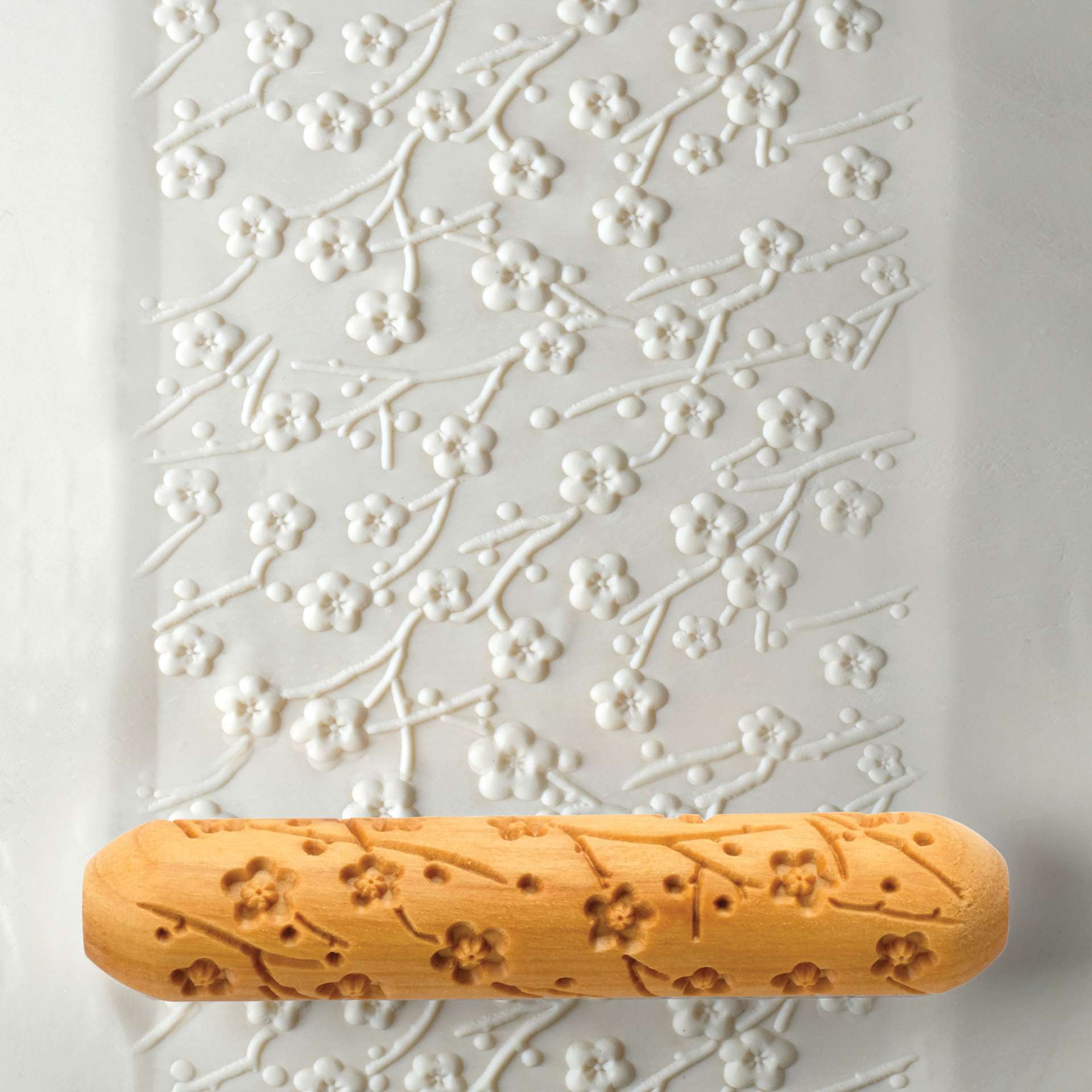 MKM Pottery Tools Big Hand Roller - Plum Blossom applied to clay