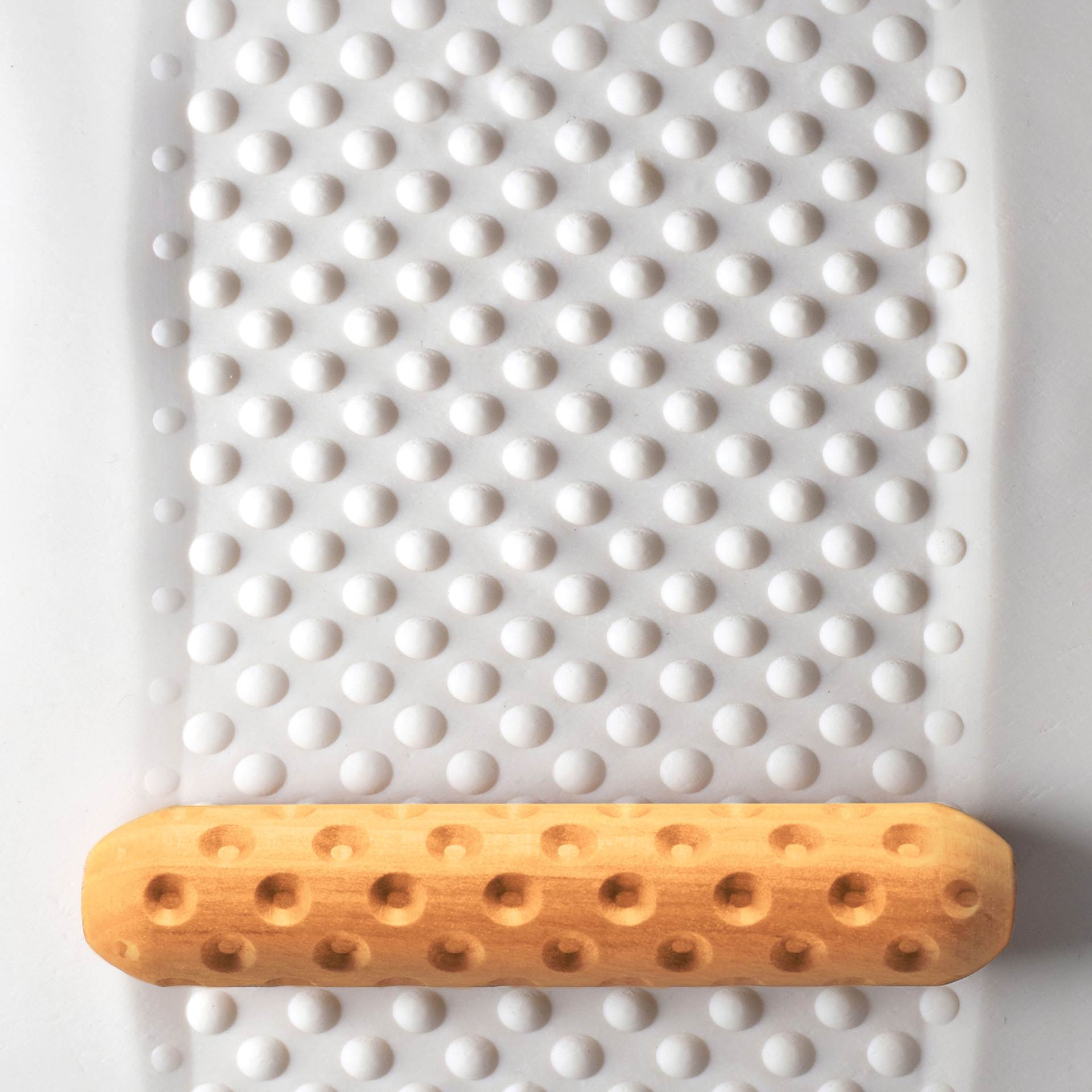 MKM Pottery Tools Big Hand Roller - Dots applied to clay
