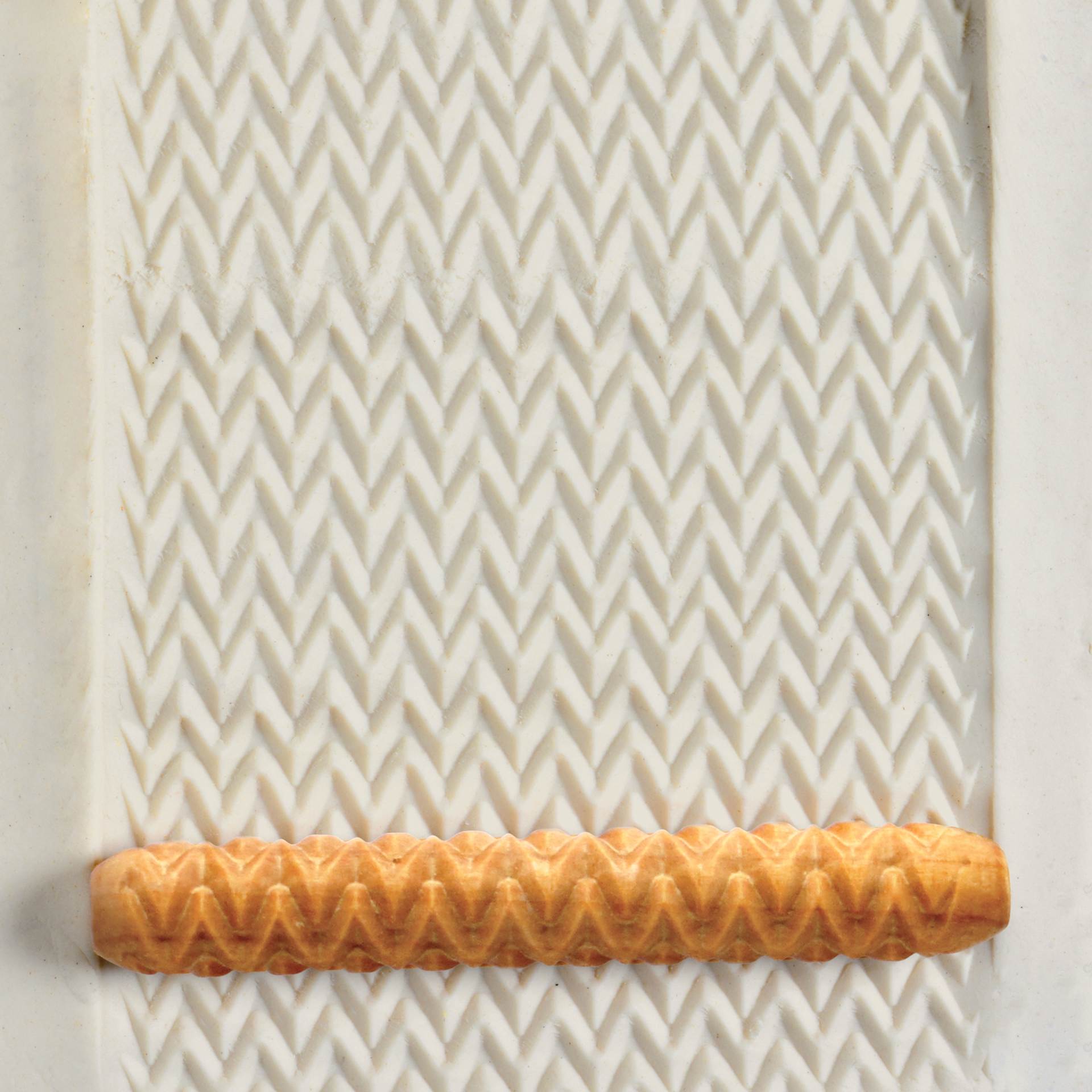 MKM Pottery Tools Hand Roller - Horizontal Zig Zag applied to clay