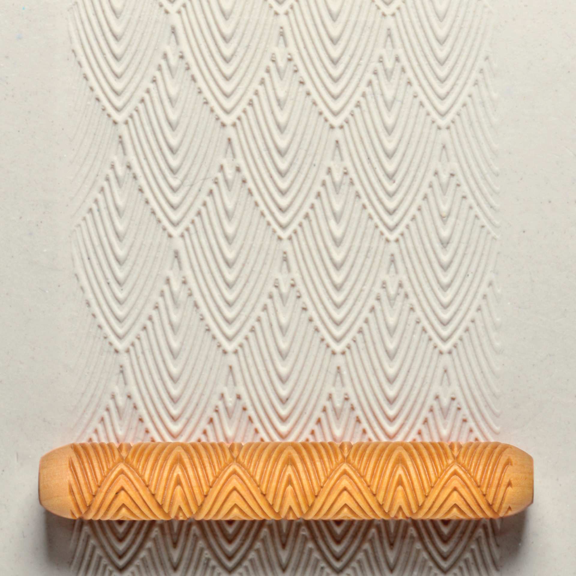 MKM Pottery Tools Hand Roller - Feathers applied to clay