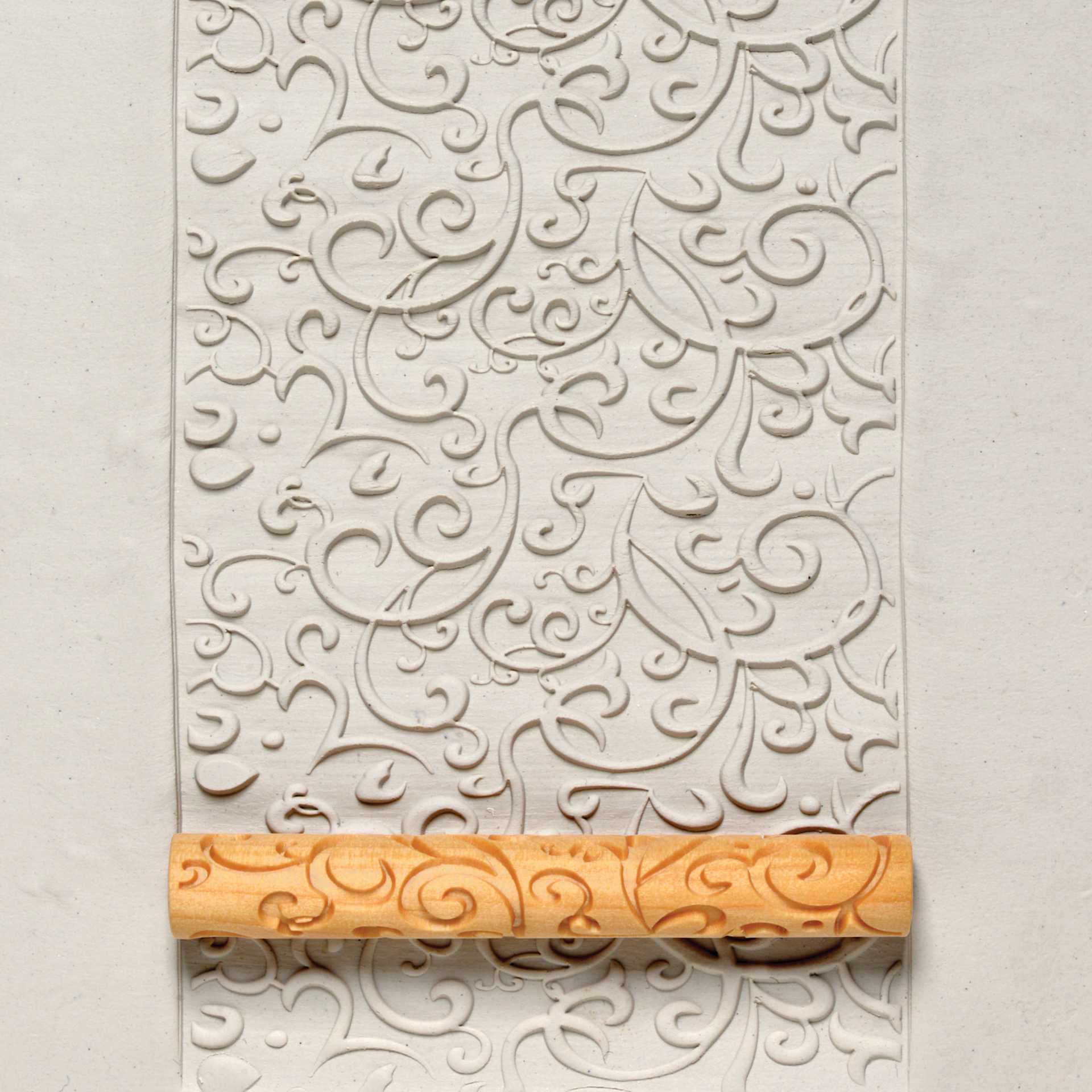 MKM Pottery Tools Twig Hand Roller - Curlicue applied to clay