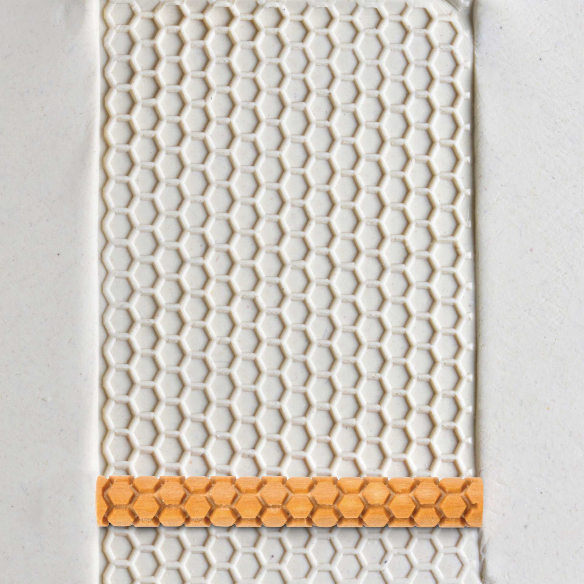 MKM Pottery Tools Twig Hand Roller - Honeycomb applied to clay
