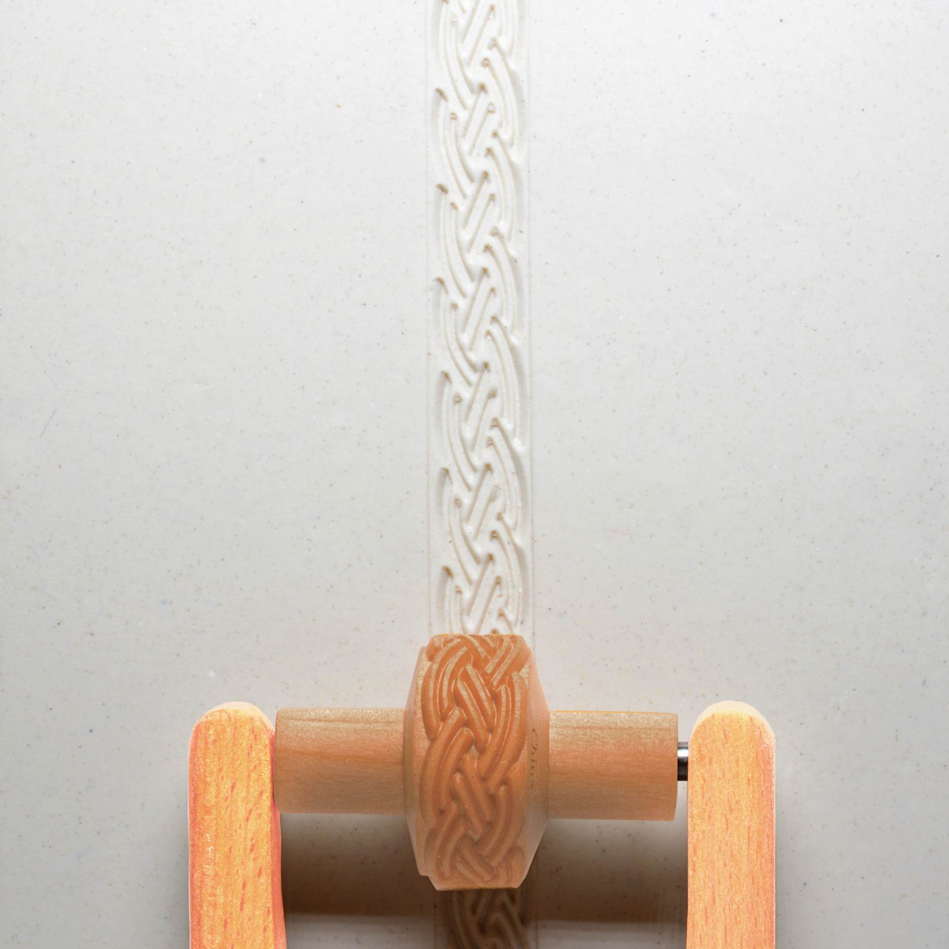 MKM Pottery Tools Small Handle Roller - Braid applied to clay