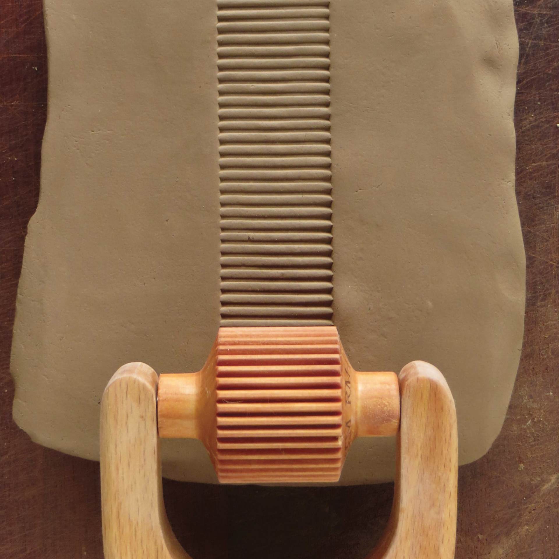 MKM Pottery Tools Medium Handle Roller - Medium, Vertical Lines applied to clay