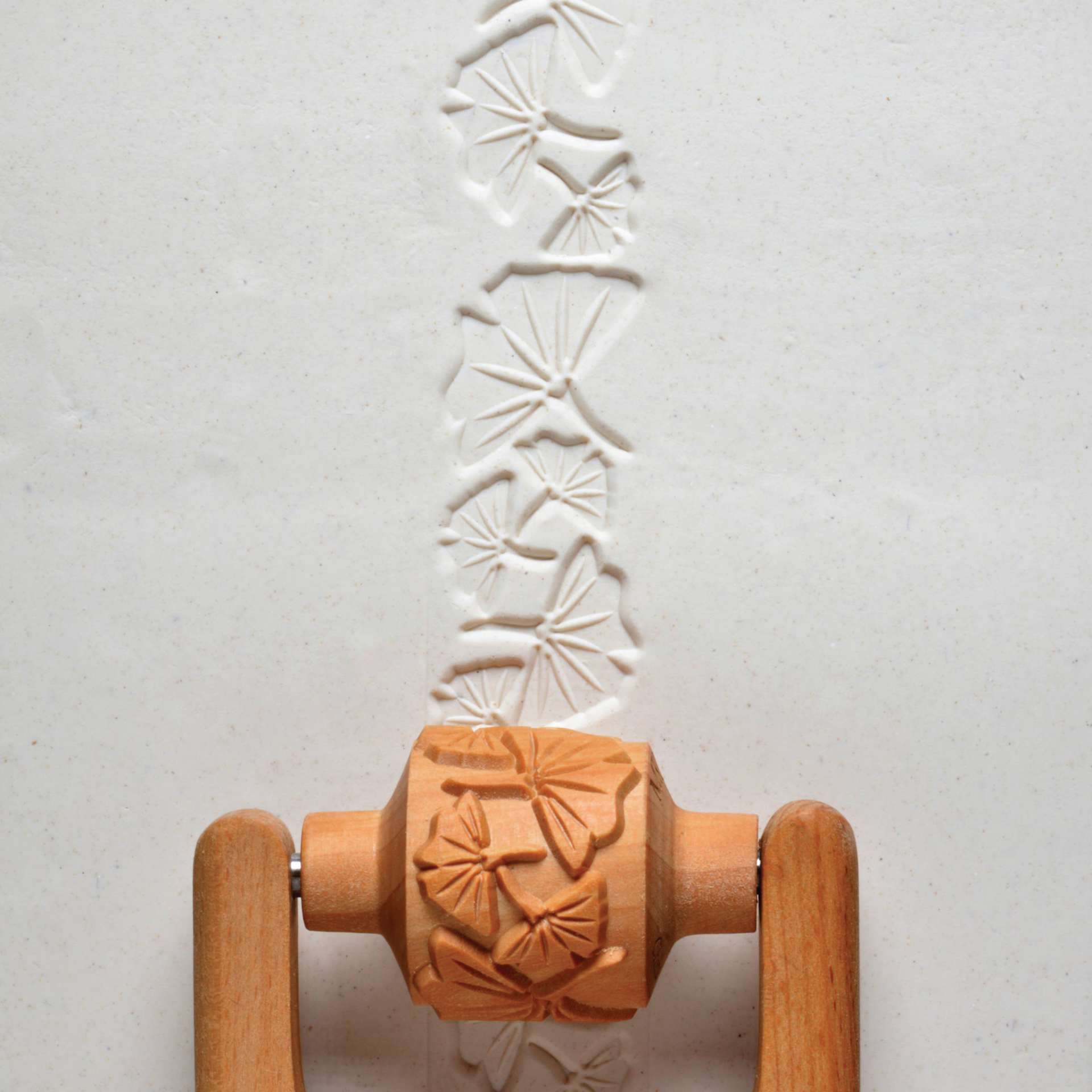 MKM Pottery Tools Medium Handle Roller - Ginkgo Leaves applied to clay