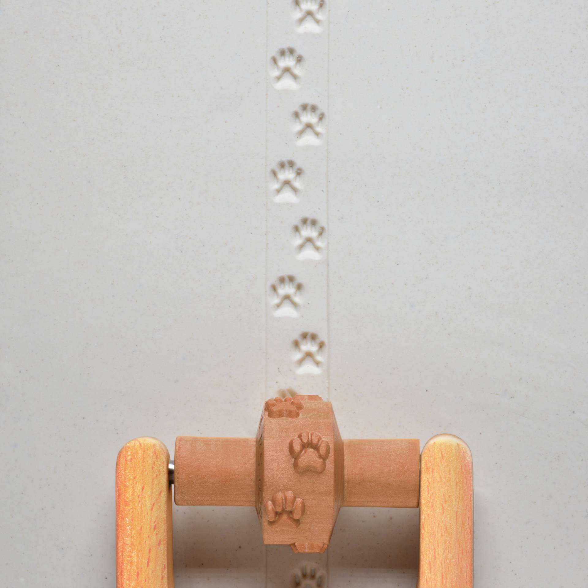 MKM Pottery Tools Small Handle Roller - Dog Prints applied to clay
