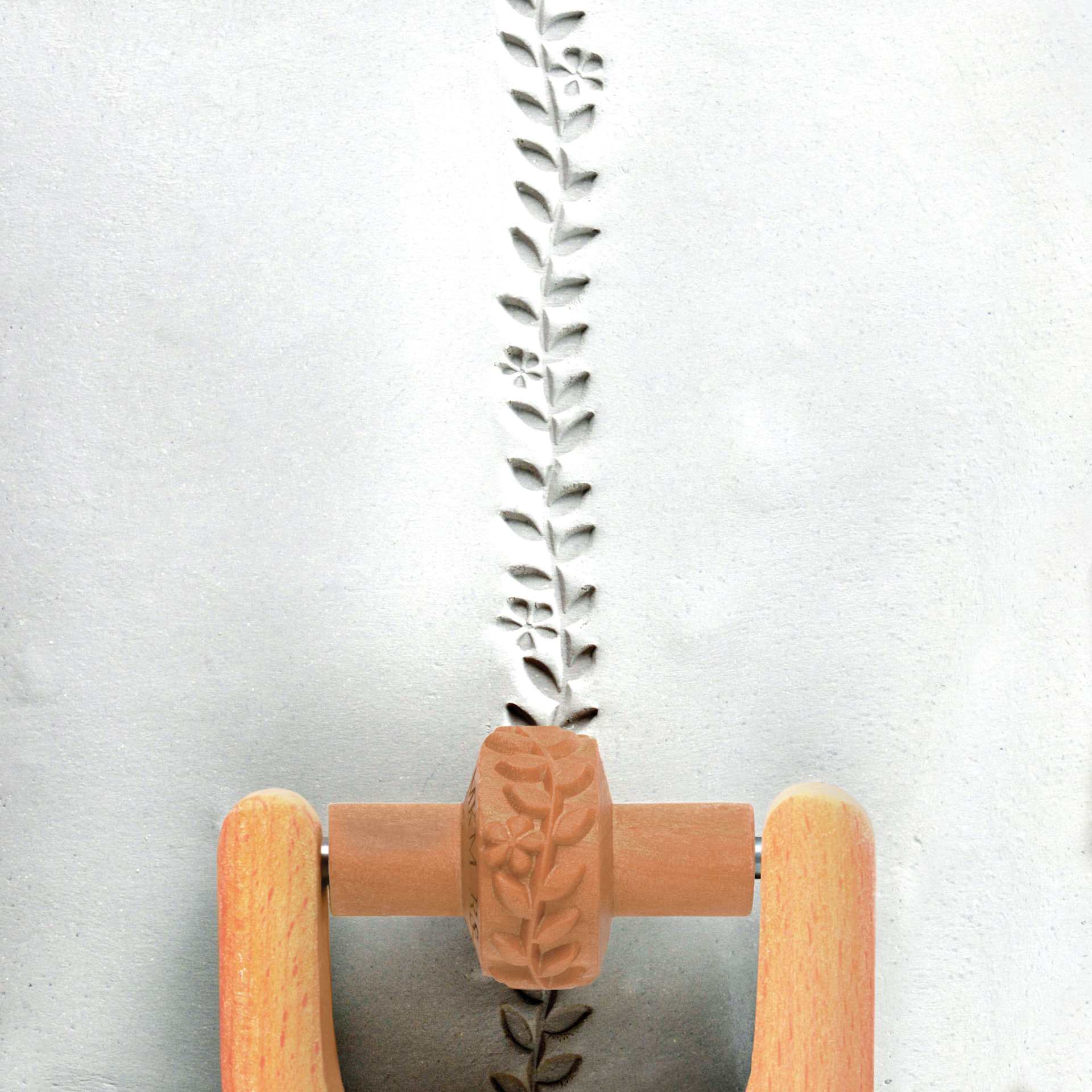 MKM Pottery Tools Small Handle Roller - Flowers and Vines applied to clay