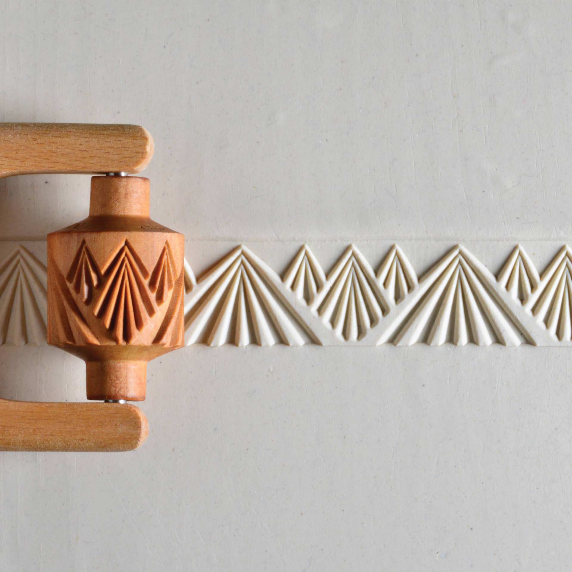 MKM Pottery Tools Medium Handle Roller - Mountain Landscape applied to clay