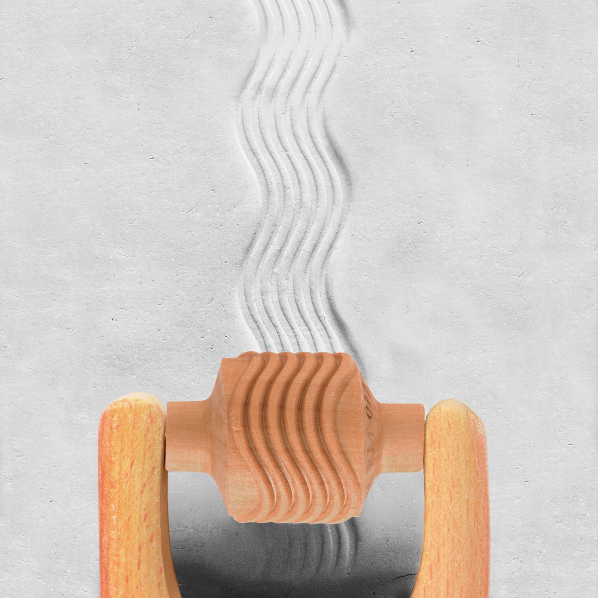 MKM Pottery Tools Medium Handle Roller - Wavy Lines applied to clay