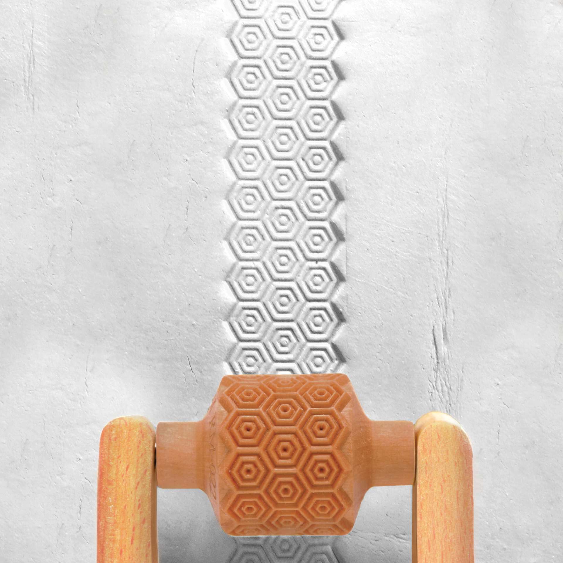 MKM Pottery Tools Medium Handle Roller - Honeycomb applied to clay