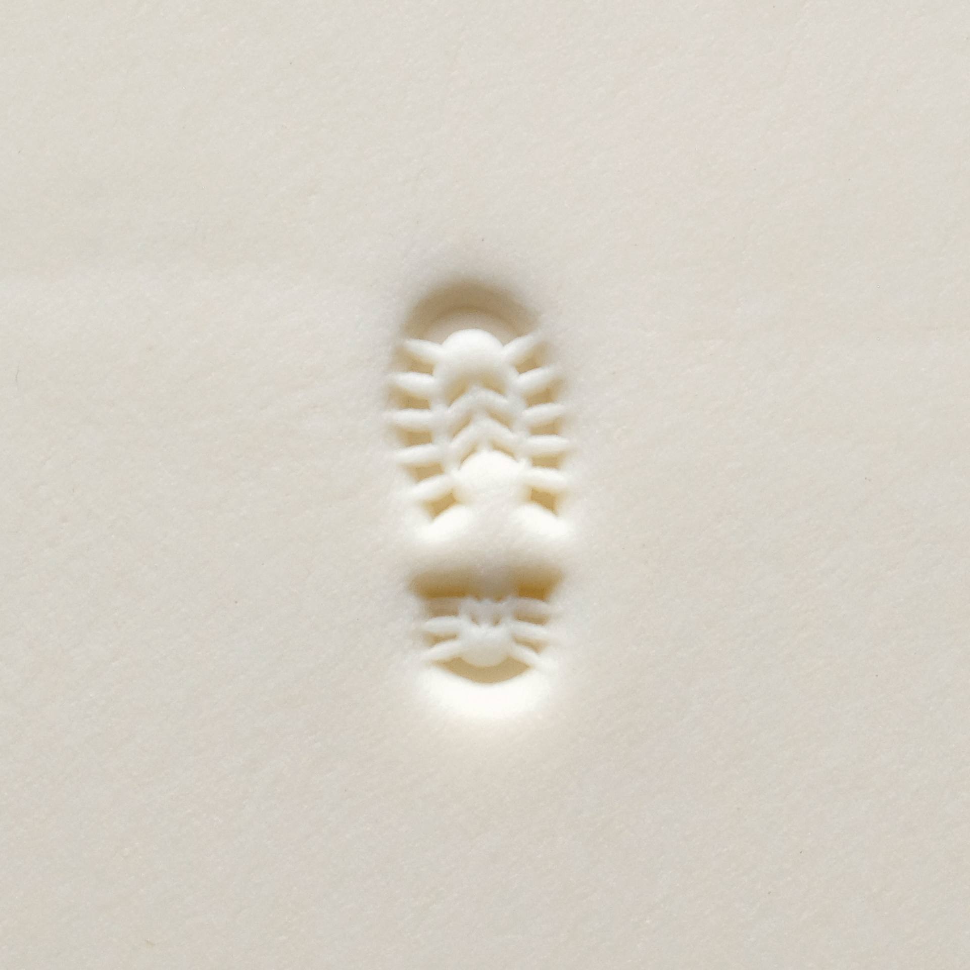 MKM Pottery Tools Small Round Stamp - SCS-215, Right Boot Print applied to clay