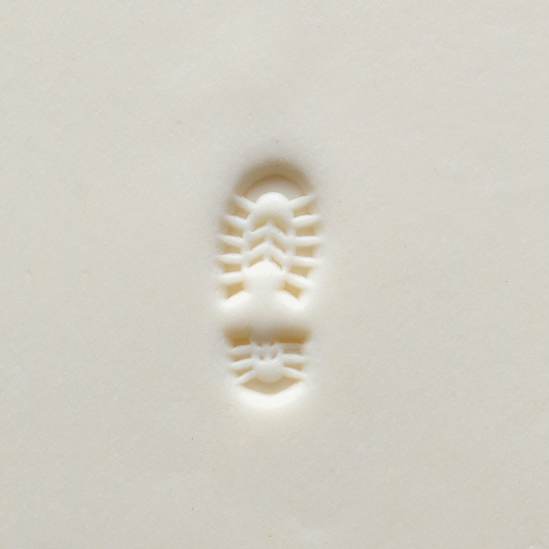MKM Pottery Tools Small Round Stamp - SCS-216, Left Boot Print applied to clay