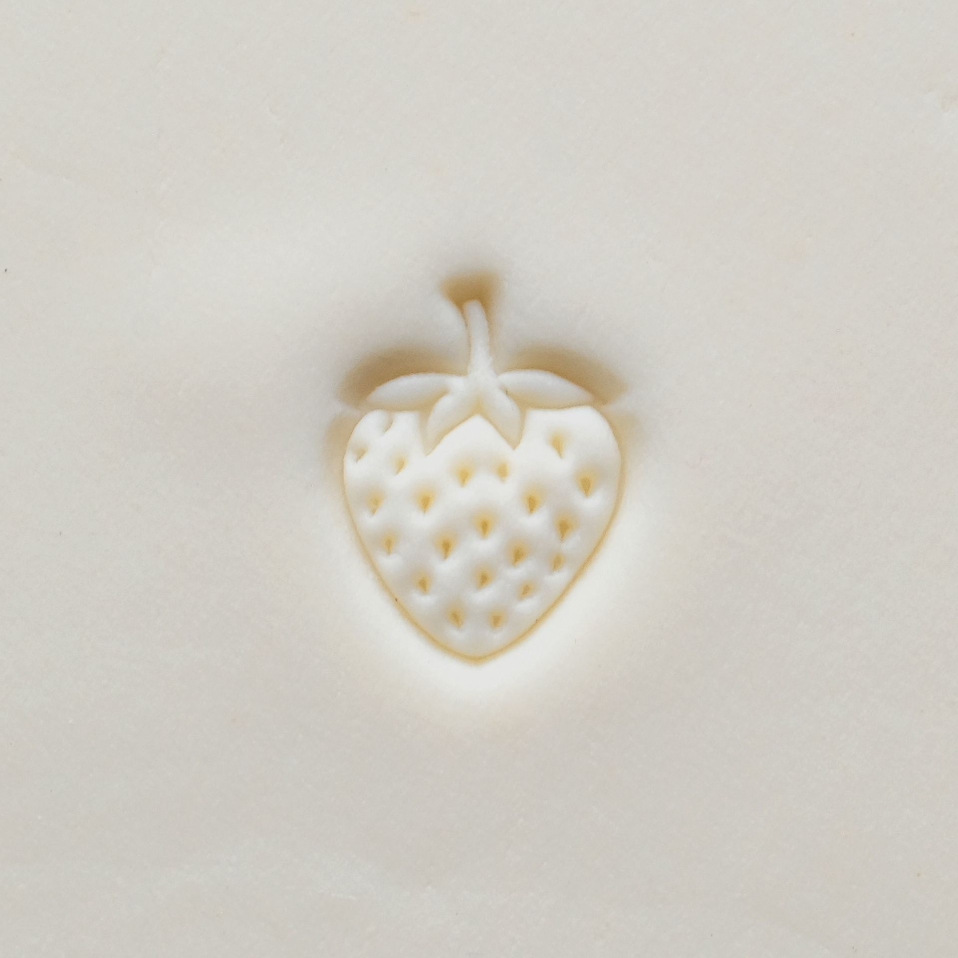 MKM Pottery Tools Small Round Stamp - SCS-217, Strawberry applied to clay