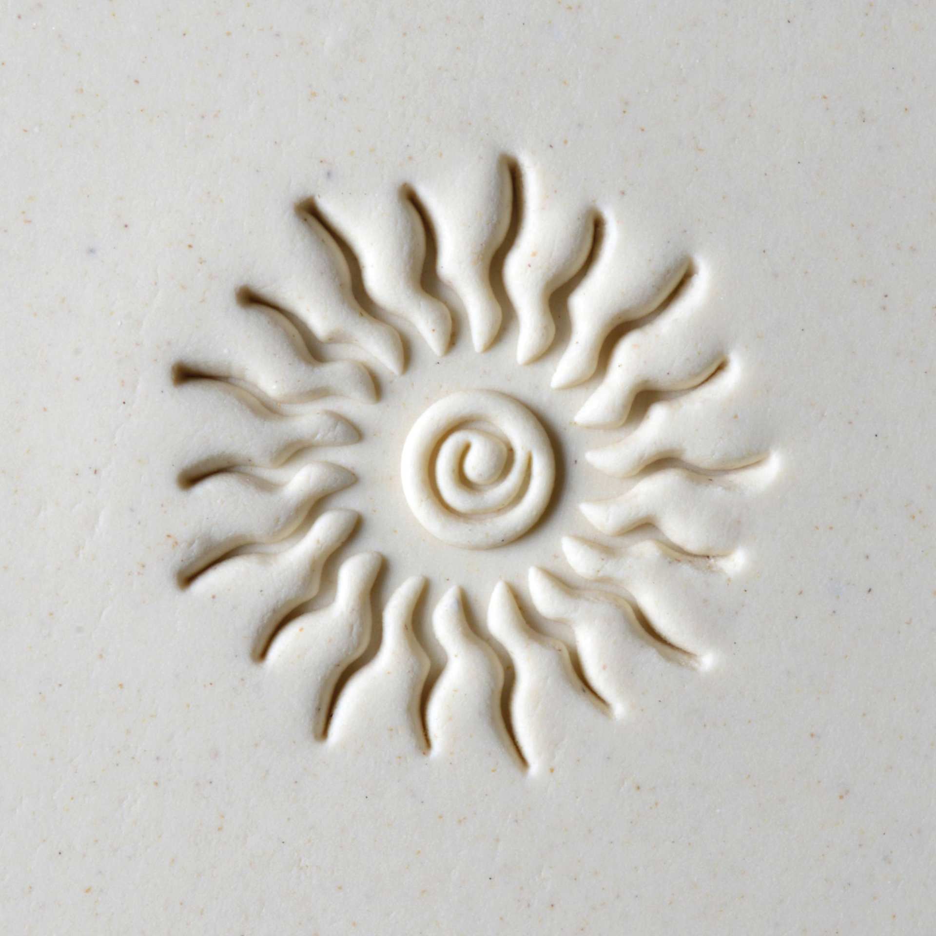 MKM Pottery Tools Large Round Stamp - SCL-004, Spiral Sun applied to clay