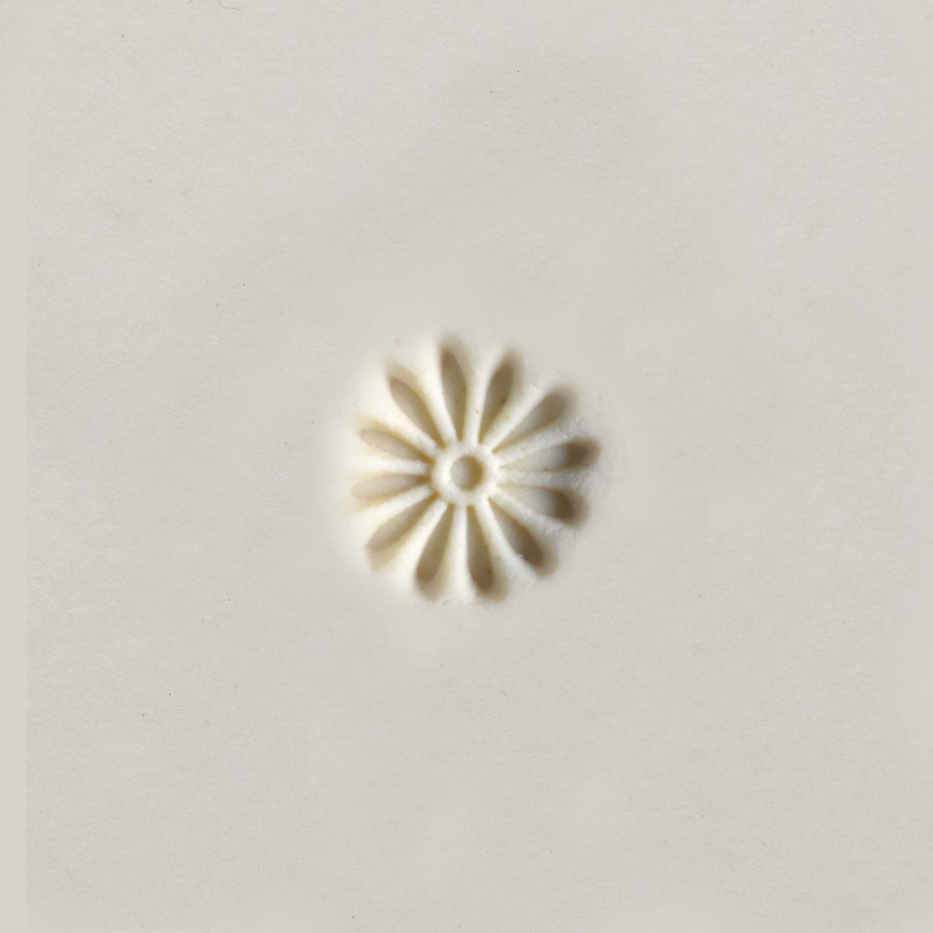 MKM Pottery Tools Mini Round Stamp - Daisy applied to clay