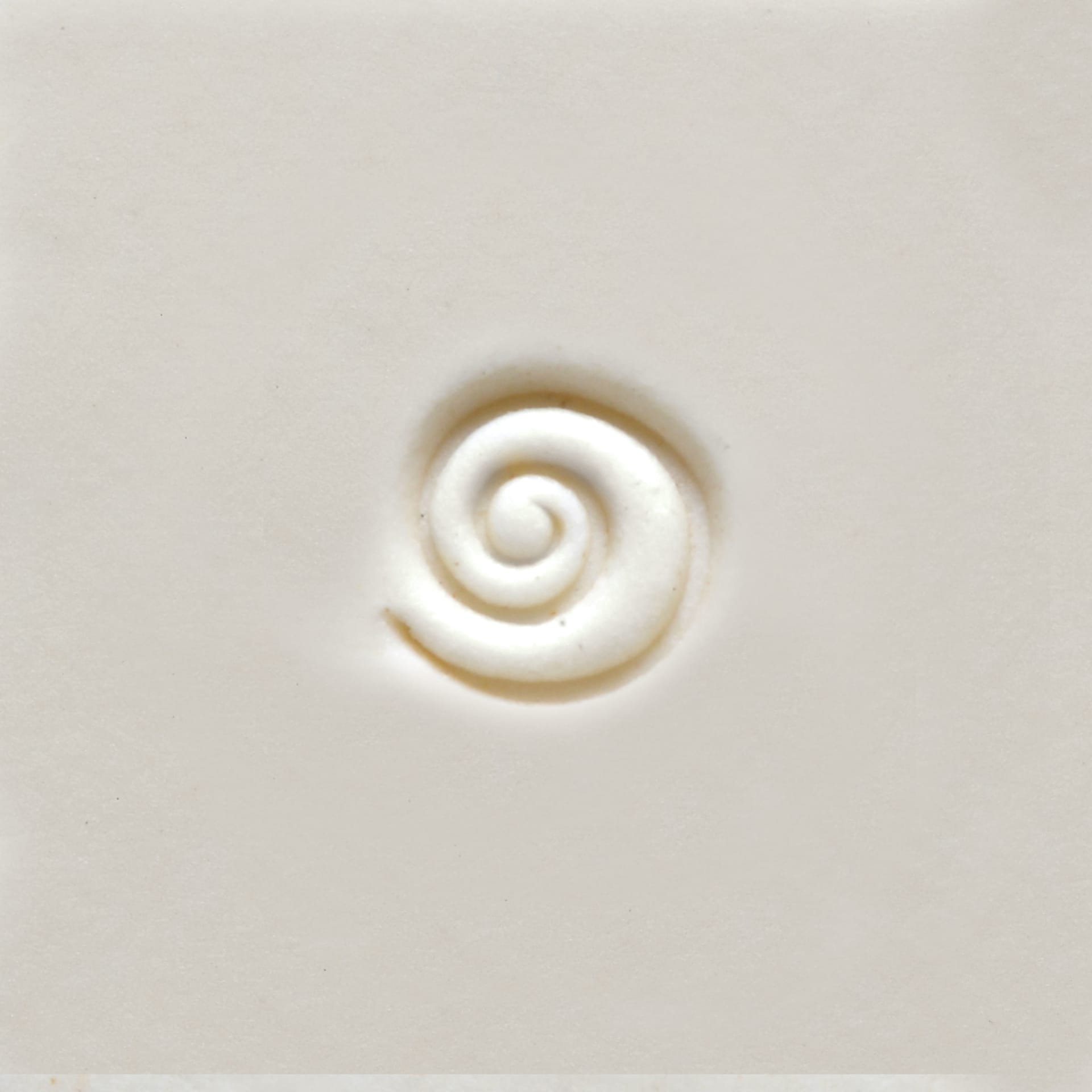 MKM Pottery Tools Mini Round Stamp - Single Spiral applied to clay