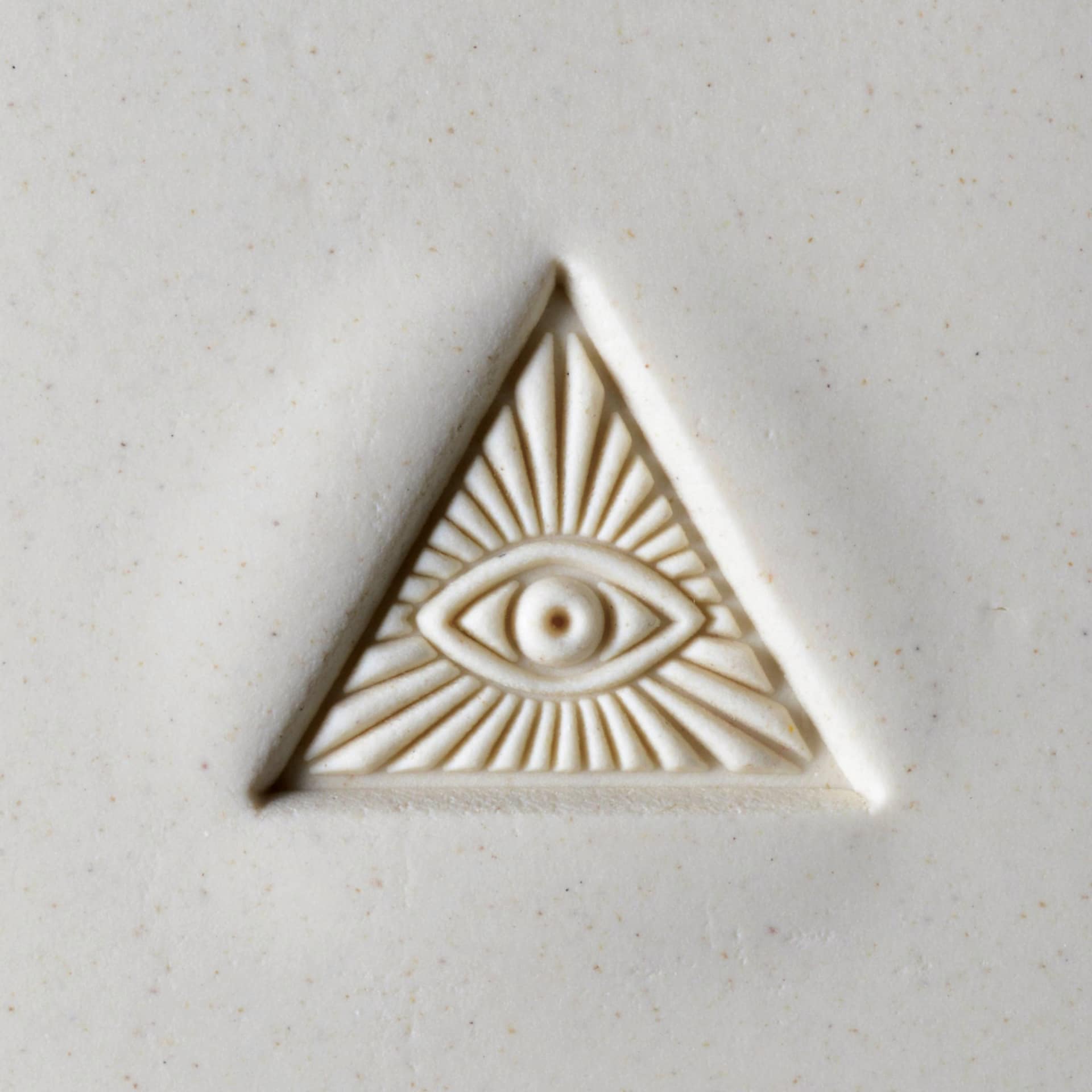 MKM Pottery Tools Large Round Stamp - SCL-016, Pyramid Eye applied to clay
