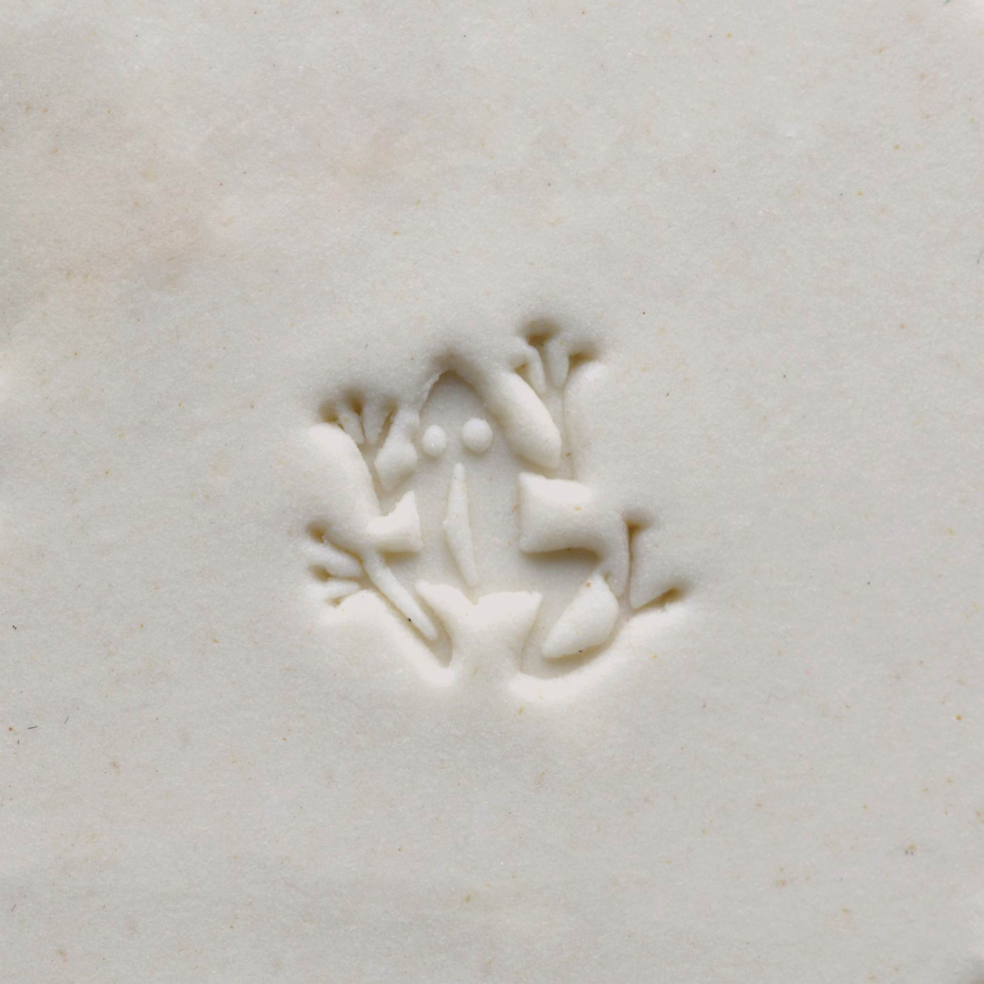 MKM Pottery Tools Small Round Stamp - SCS-156, Dancing Frog applied to clay