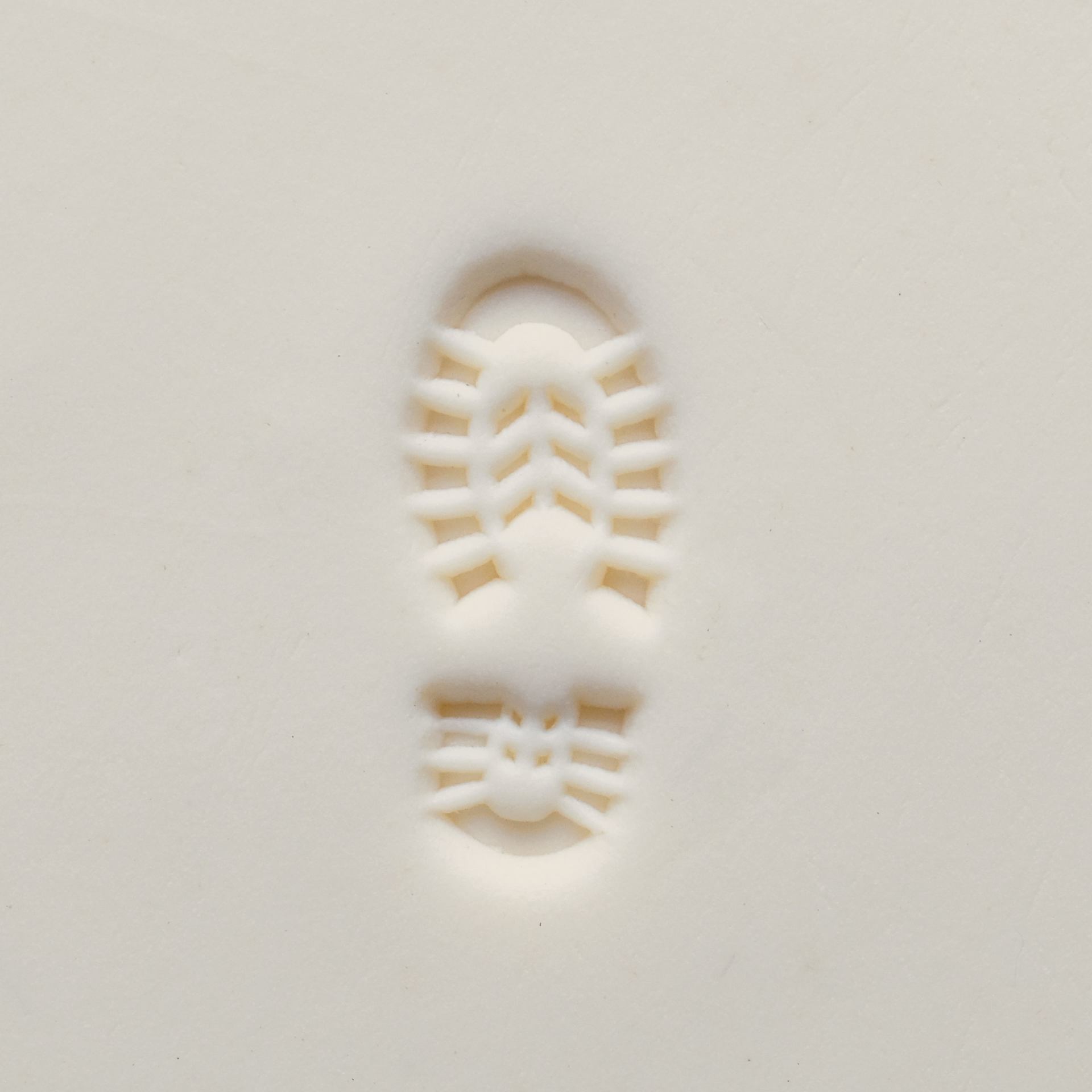 MKM Pottery Tools Medium Round Stamp - SCM-298, Right Boot Print applied to clay