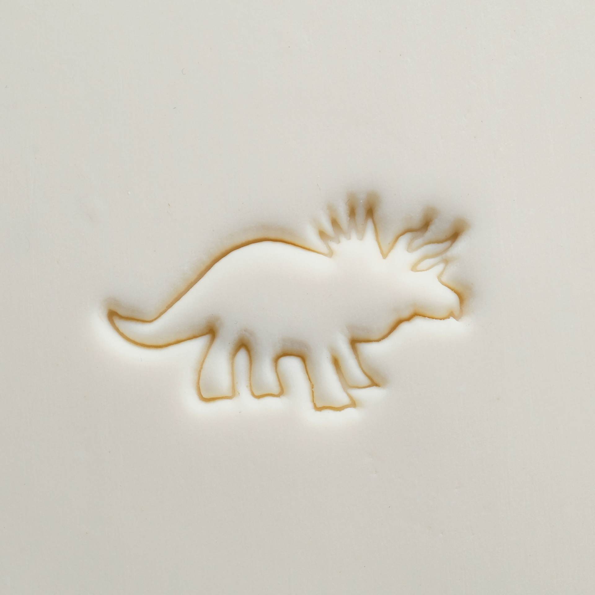 MKM Pottery Tools Large Round Stamp - SCL-165, Triceratops applied to clay