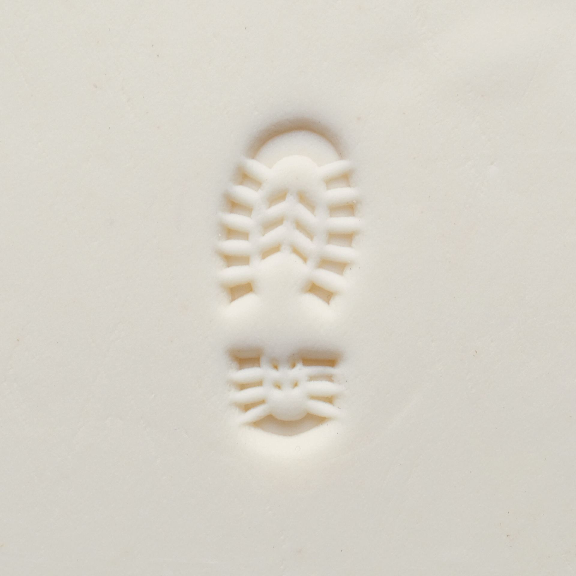 MKM Pottery Tools Medium Round Stamp - SCM-299, Left Boot Print applied to clay