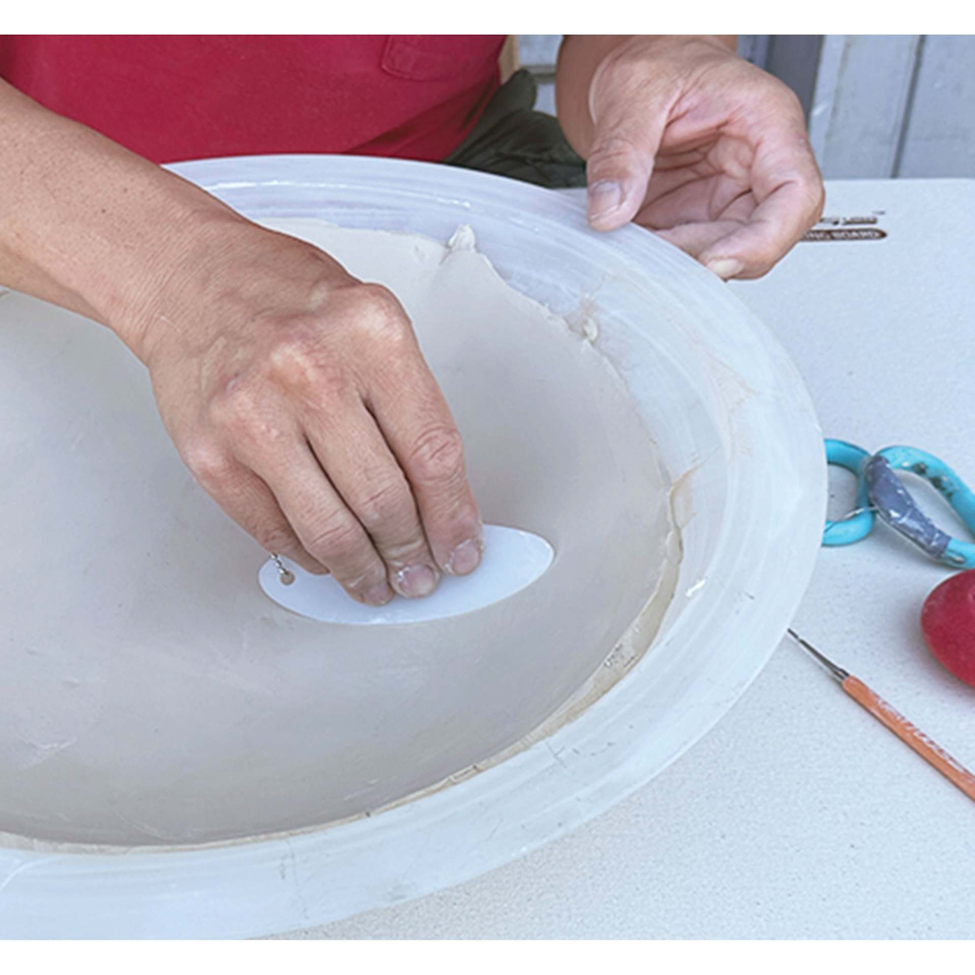 Xiem Silicone Clay Slicker smoothing clay into mold