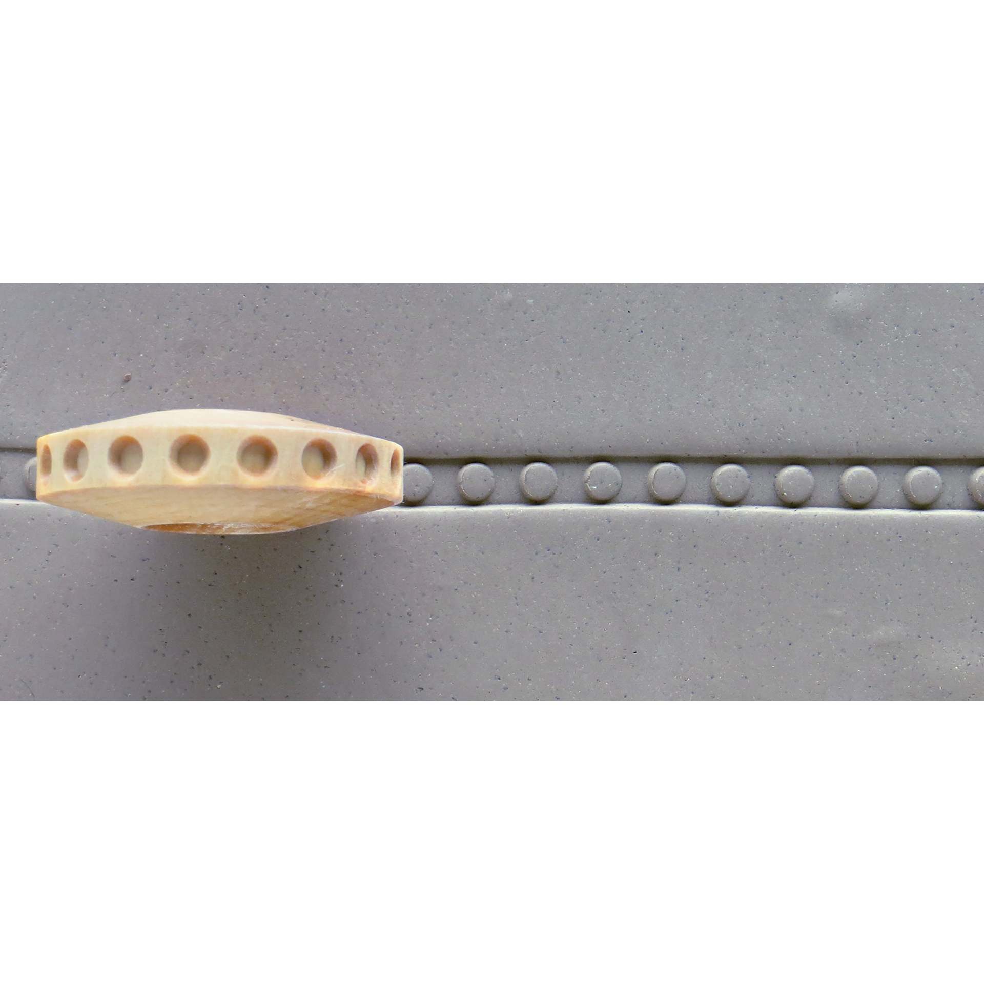 MKM Pottery Tools Finger Roller - Dots applied to clay