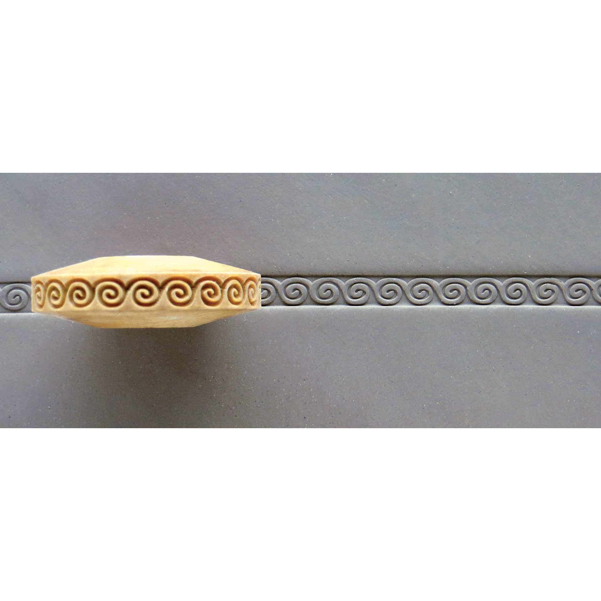 MKM Pottery Tools Finger Roller - Greek Key Spiral applied to clay