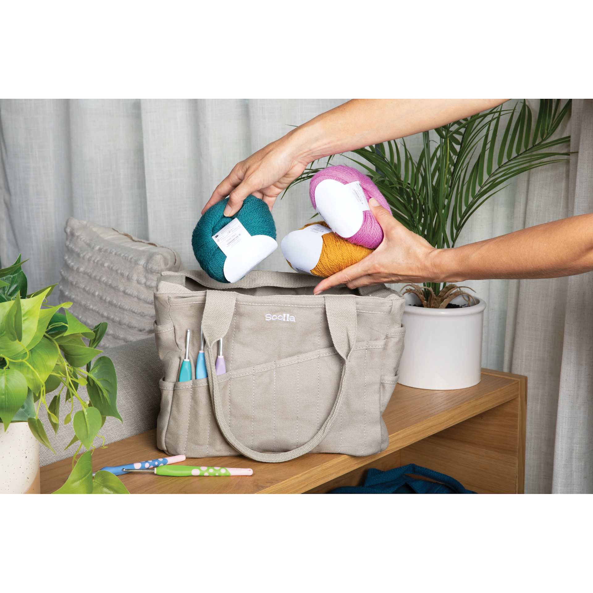 Soolla Studio Art Supply & Pottery Tool Bag - Graphite with yarn being packed away