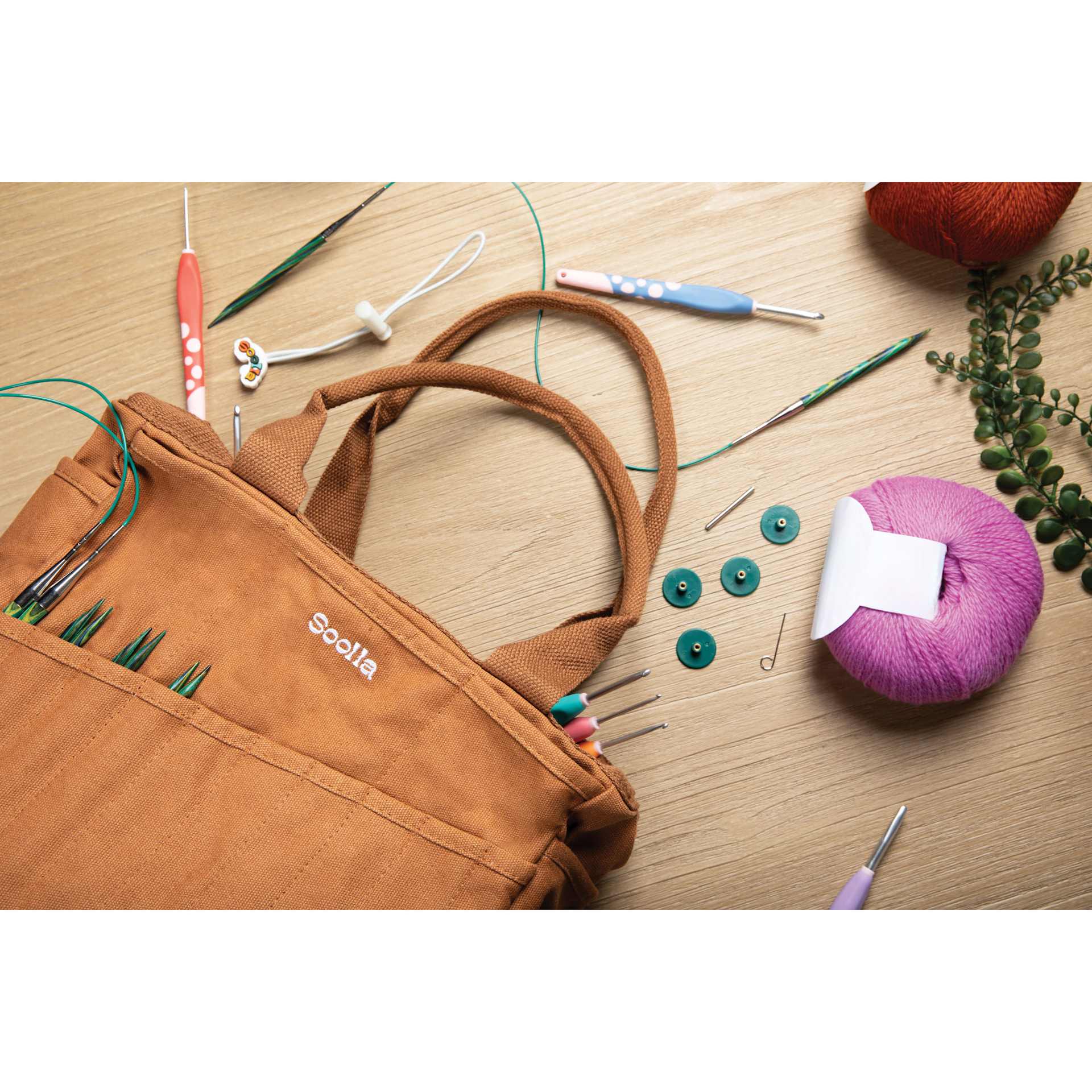 Soolla Studio Art Supply & Pottery Tool Bag - Cinnamon with contents laid out around it