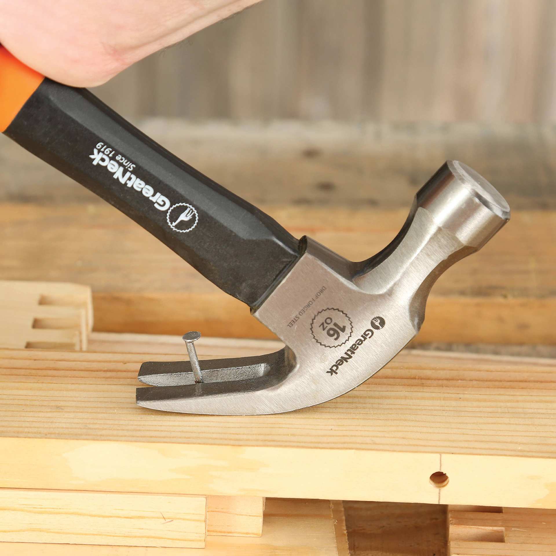 GreatNeck Fiberglass Curved Claw Hammer - in use to remove nail