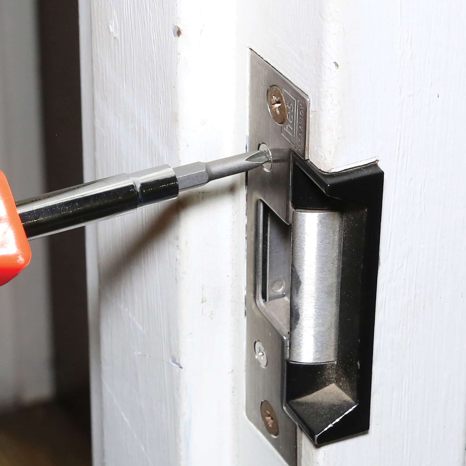 GreatNeck 6-in-1 Screwdriver installing door strike plate