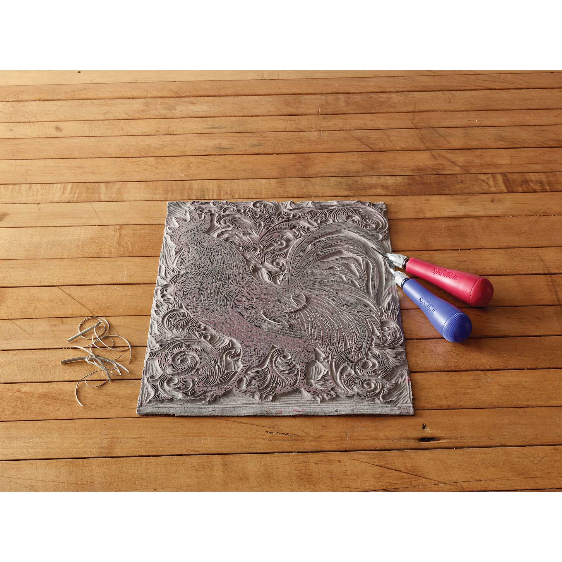 Speedball Linoleum Handles - two Lino Handles No. 2 next to carved block with rooster design