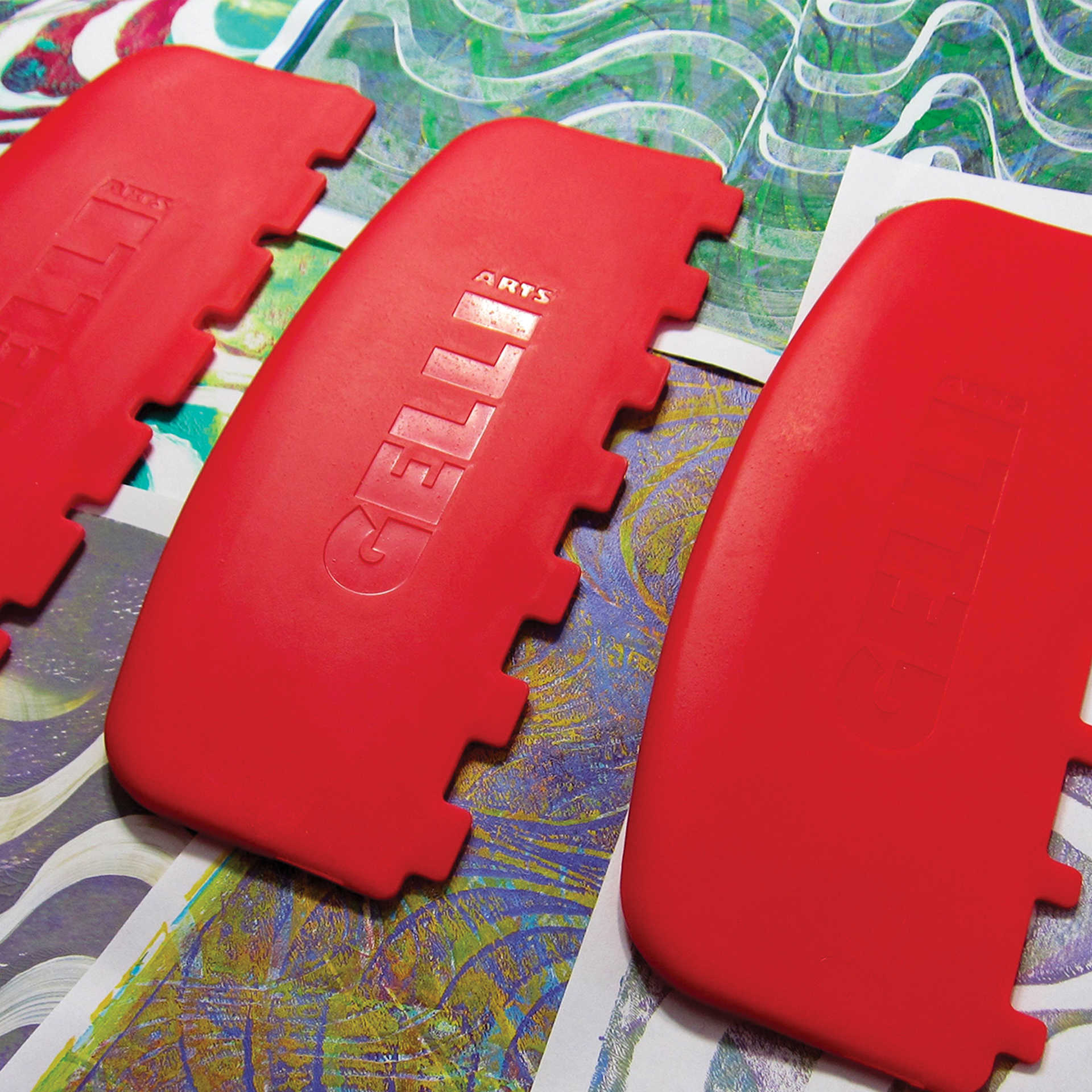 Gelli Arts Large Printing Tools - Set of 3, Square sitting on completed prints