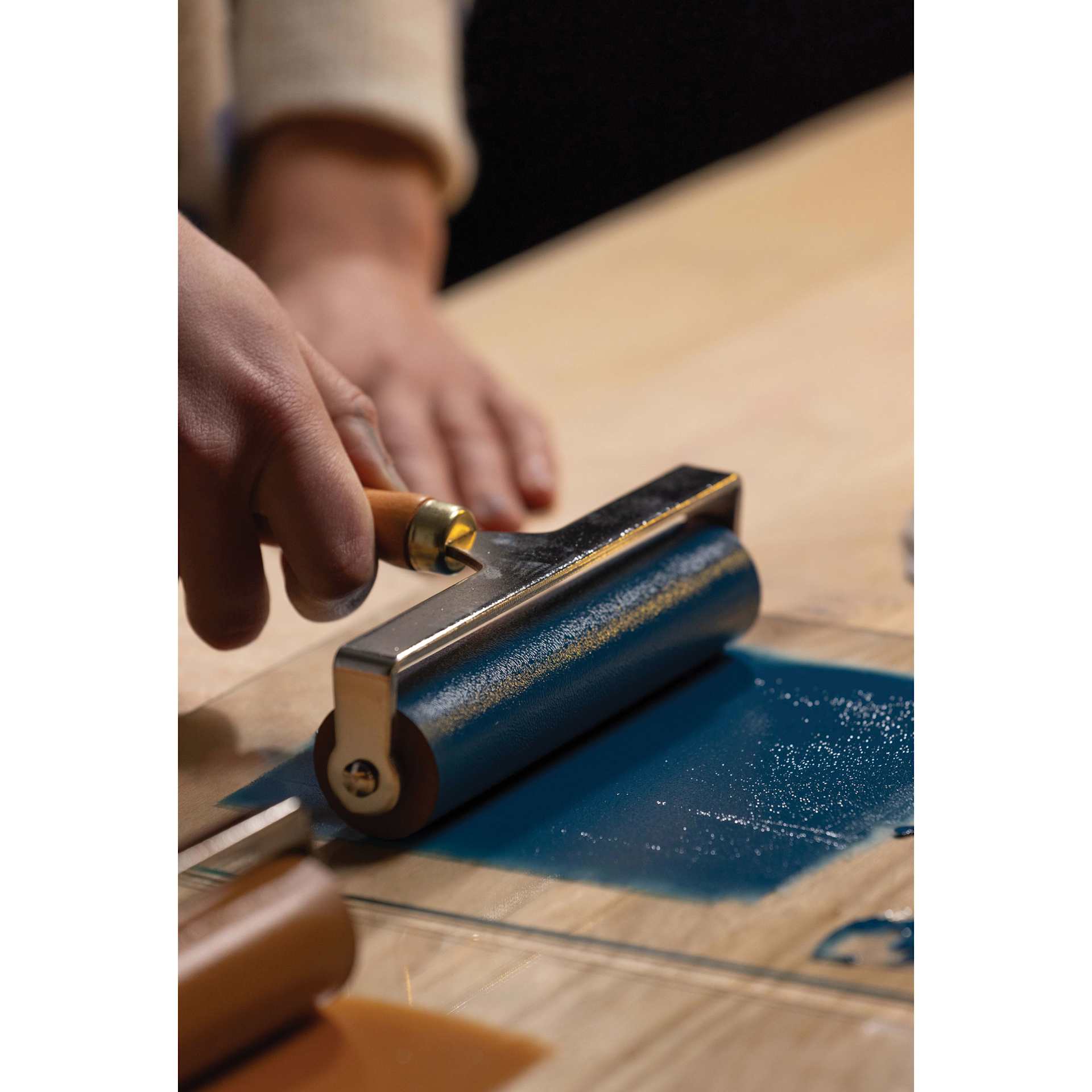 Pebeo Lino Ink - Prussian Blue, 80 ml Tube being applied with brayer