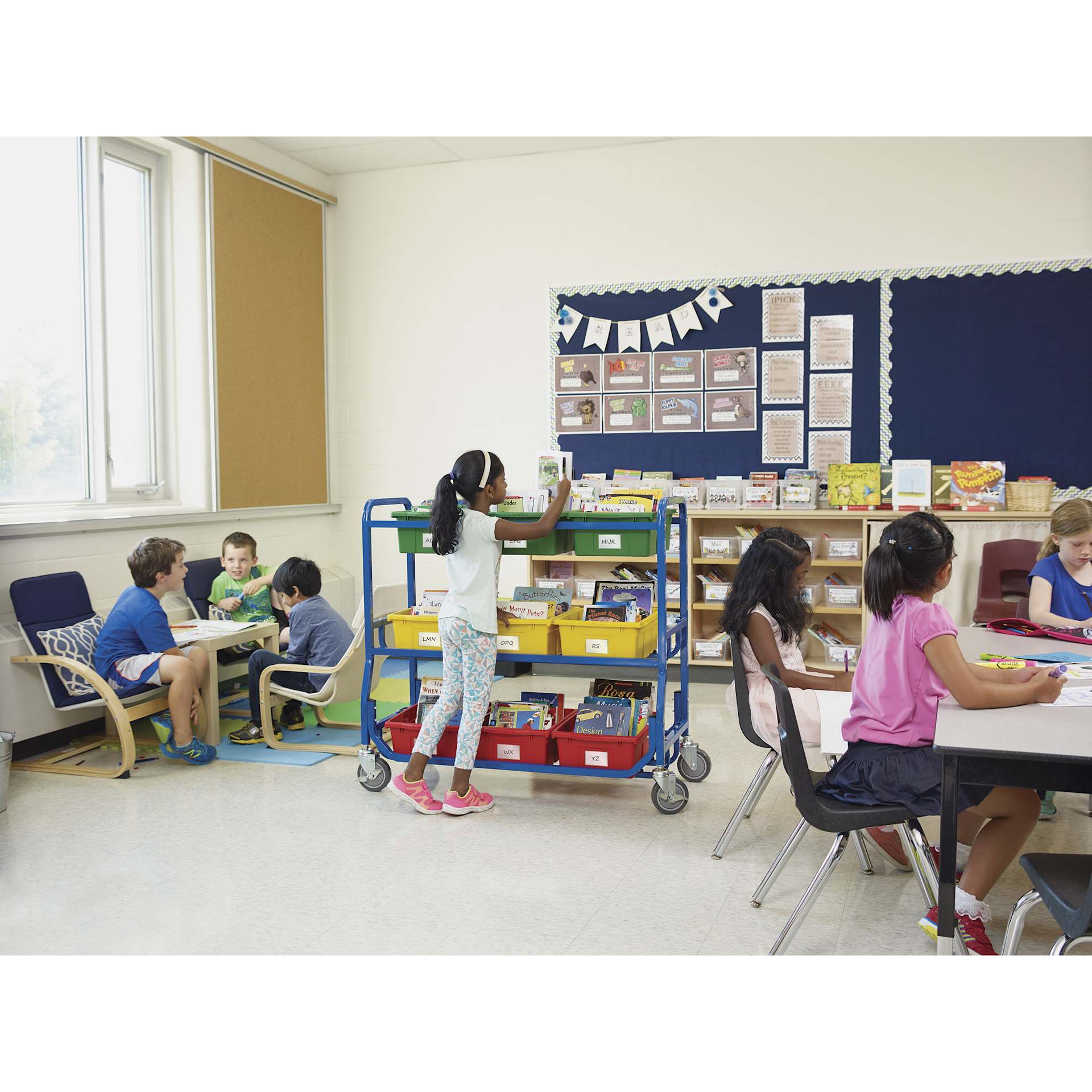 Copernicus Library On Wheels, student using storage bin