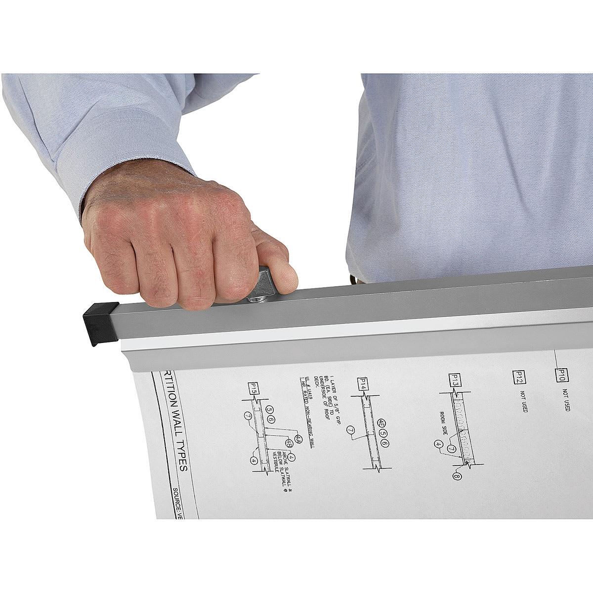 Vertical File  - Closeup of person carrying single clamp with blueprints