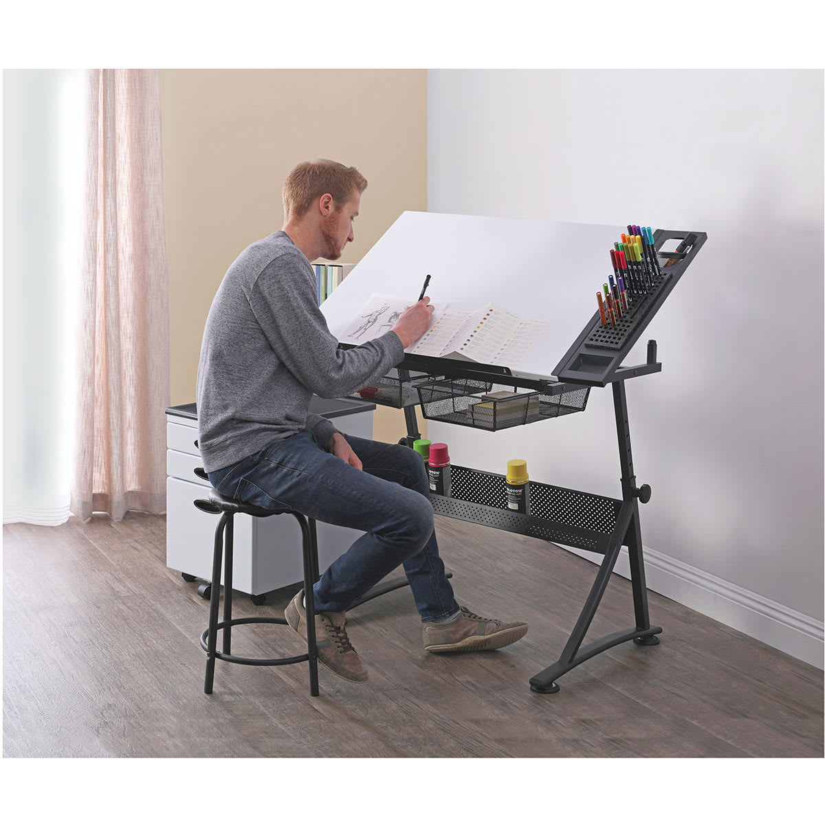 Studio Designs Premier Metal Art Trays - Artist seated at desk with attached Metal Art Tray
