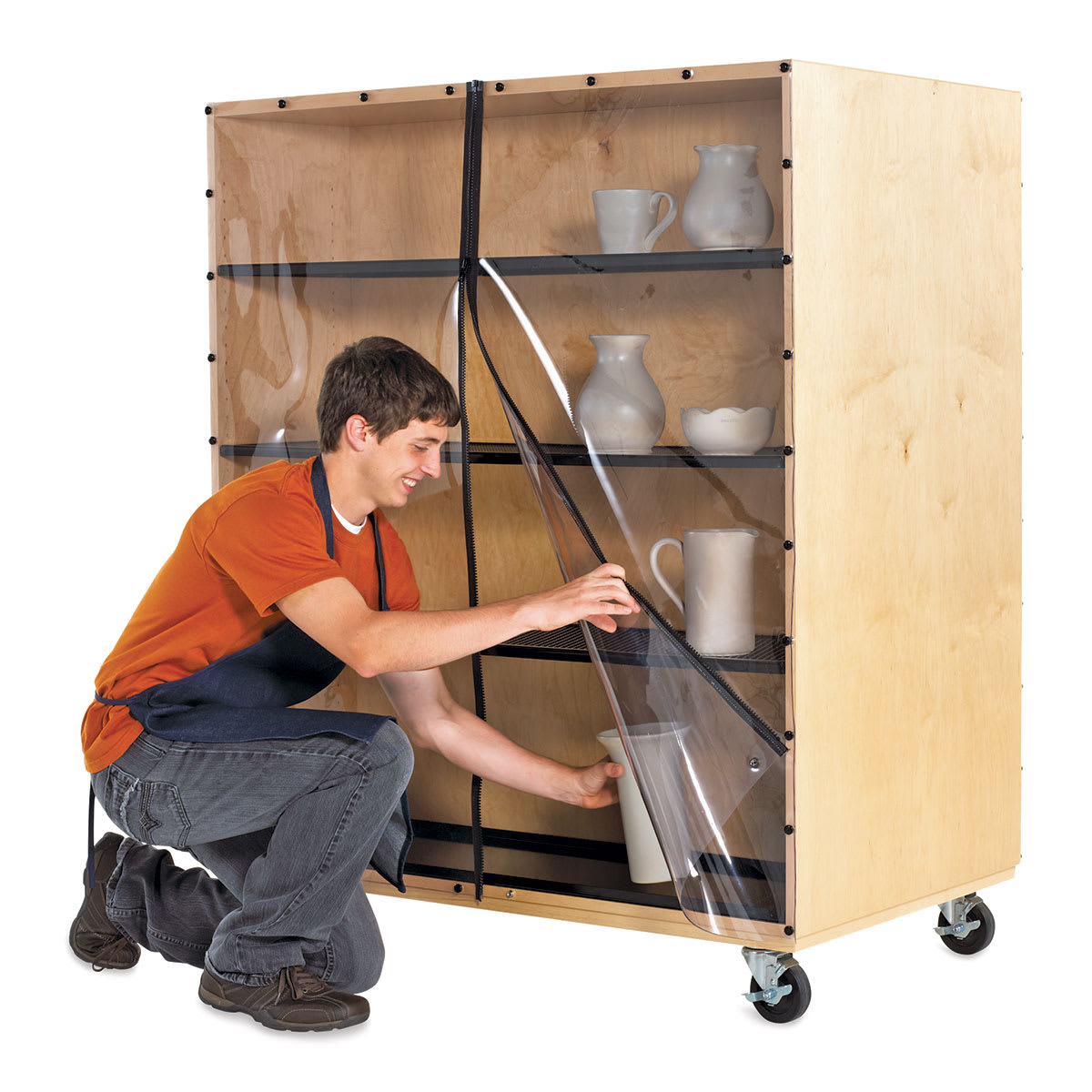 Diversified Spaces Sculpture Ware Cart - Artist placing ceramic vase on shelf to dry