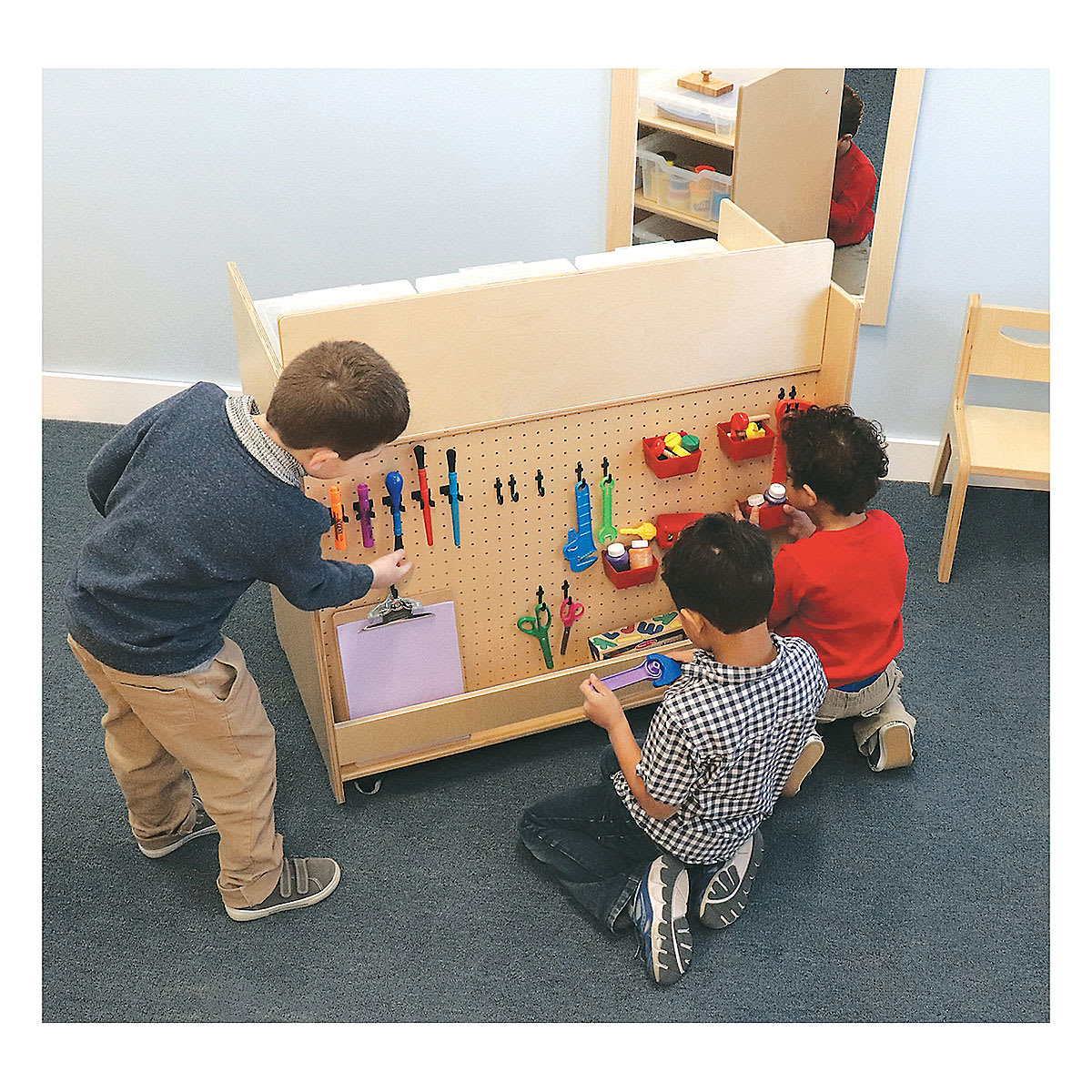 Whitney Brothers Storage STEM Cart - Three children selecting supplies from pegboard side