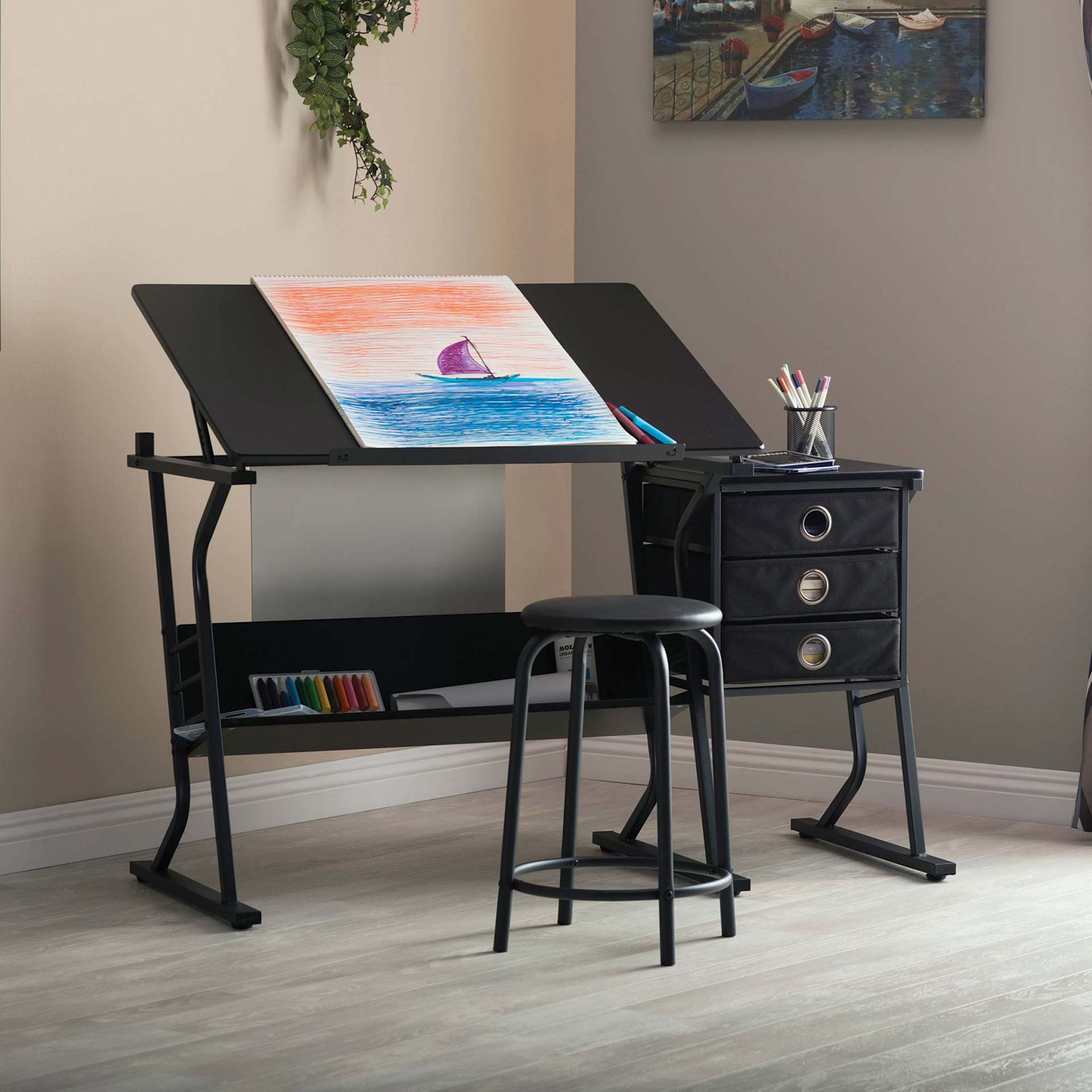 Studio Designs Eclipse Table and Stool Set, stationed in a room with art supplies (not included)