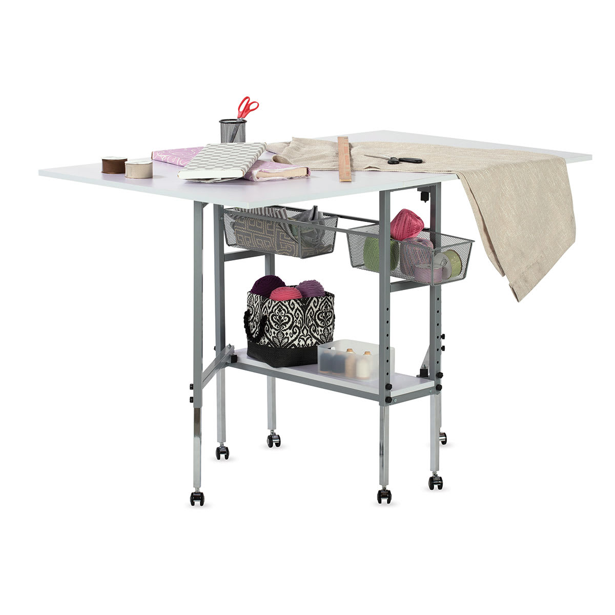 Studio Designs Hobby Table - Angled view with panels raised and shelf and bins filled with supplies