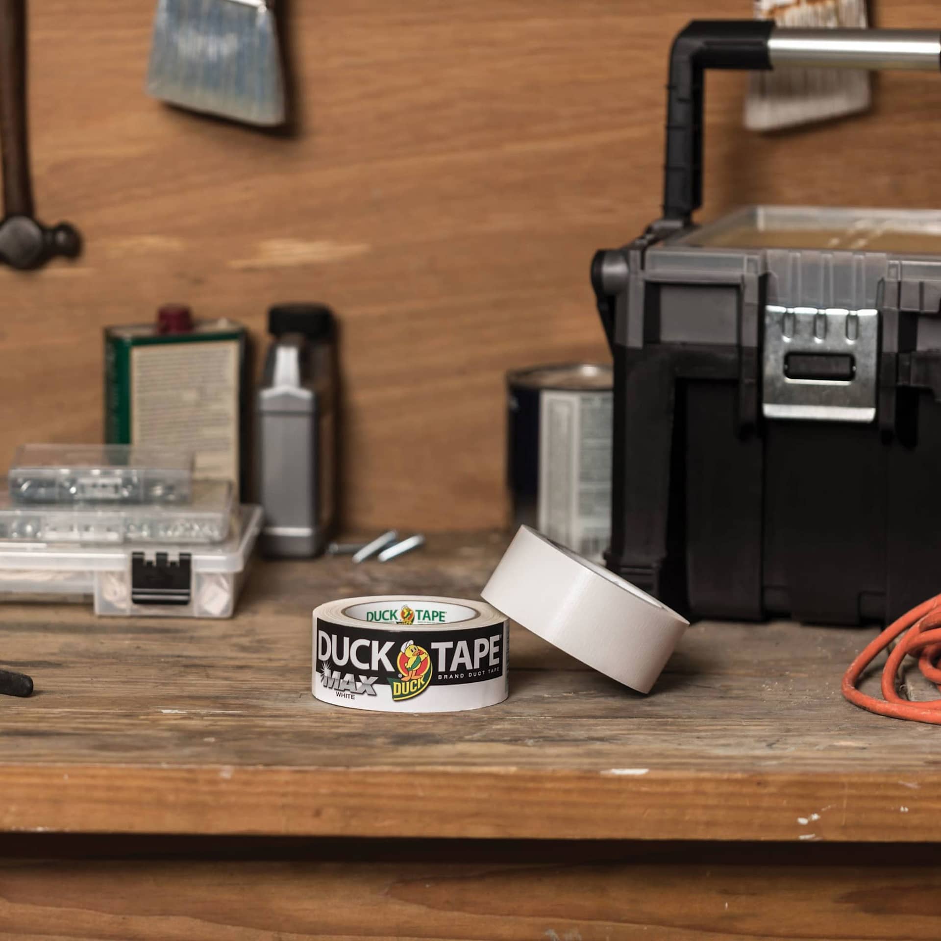 Duck Max Strength Tape - White, 1.88" x 35 yds rolls laying on table