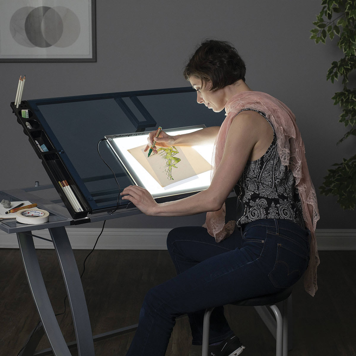 Artograph Featherweight LightPad - 12" x 17" (Person using LightPad at desk)