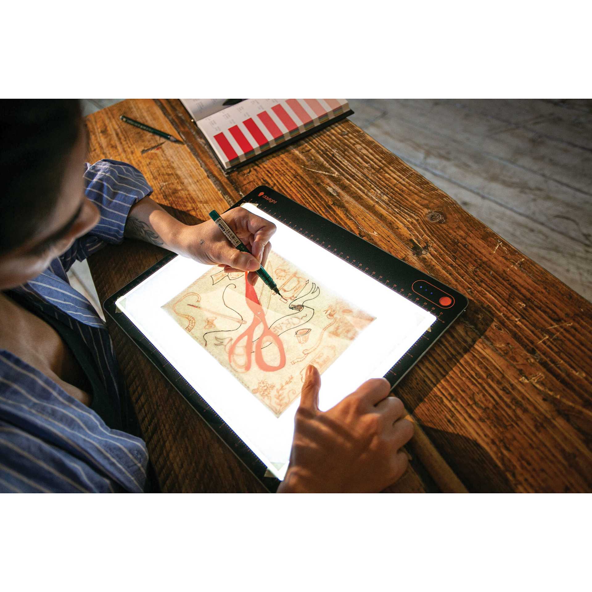 Daylight Tabla Go Rechargeable Light Pad - in use